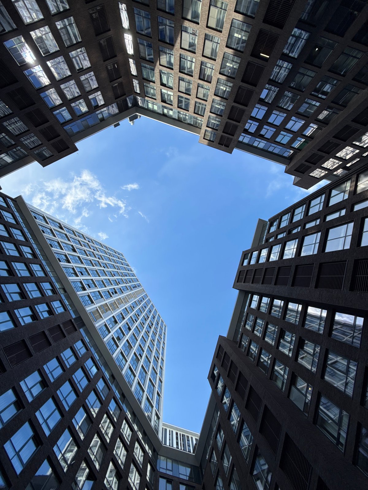 Moscow witness photographs tall buildings from ground perspective
