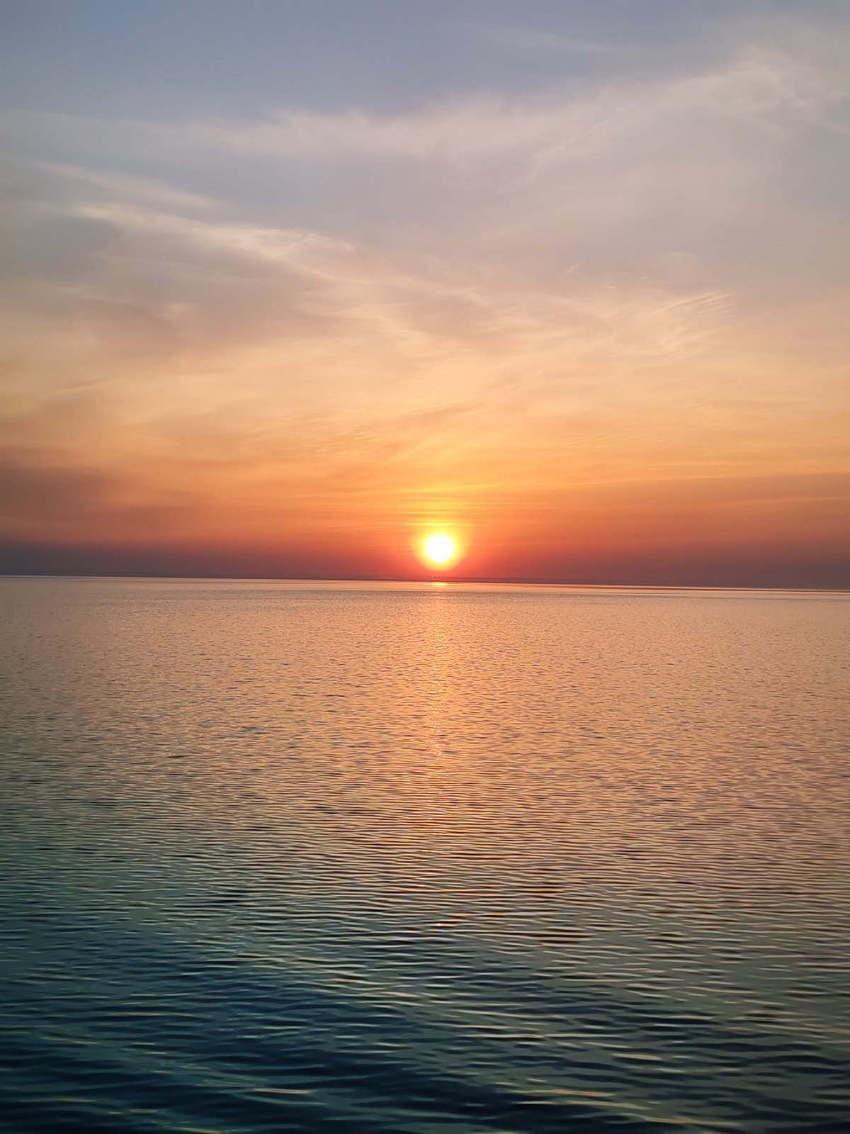 Sunset observed over water with vessel in Bol'shie Mkhi