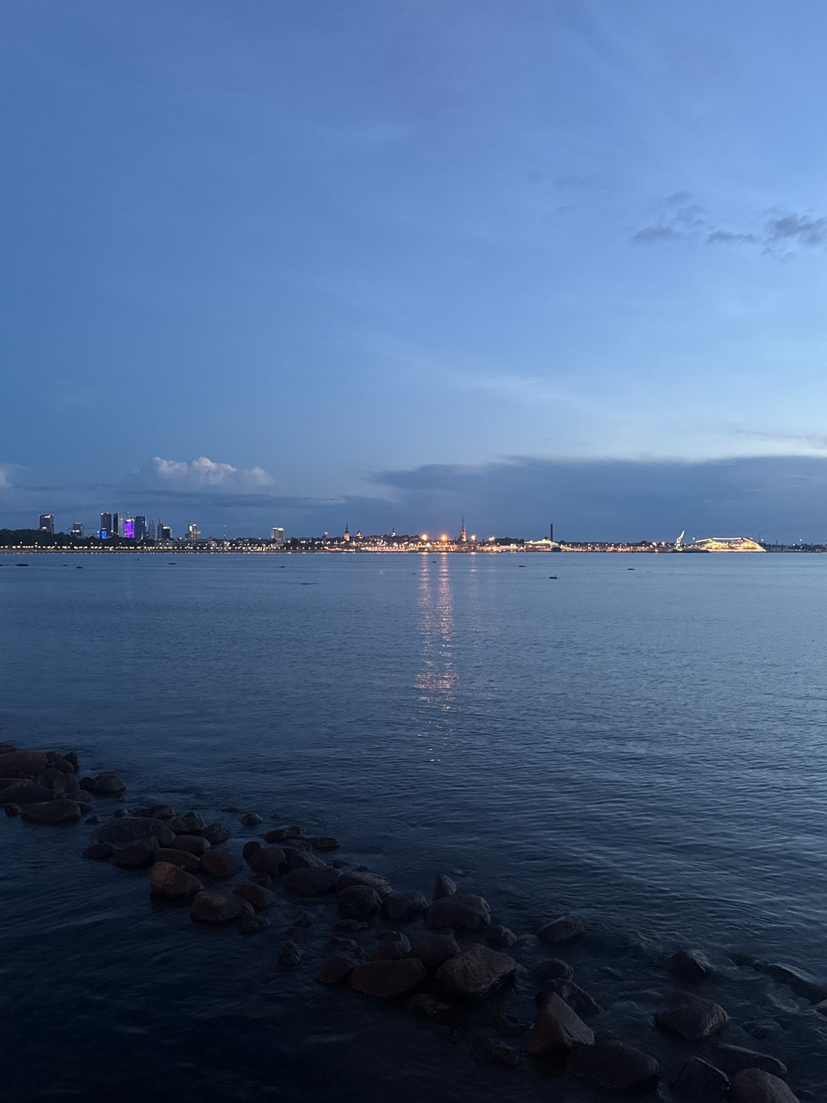 Tallinn waterfront at dusk, cruise ship and skyline