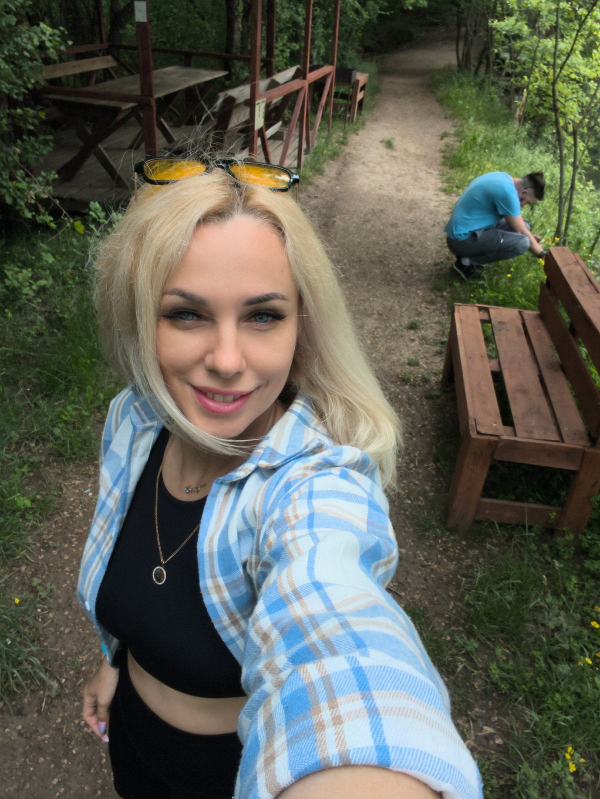 Woman documents peaceful morning at Ukrainian lakeside camping area