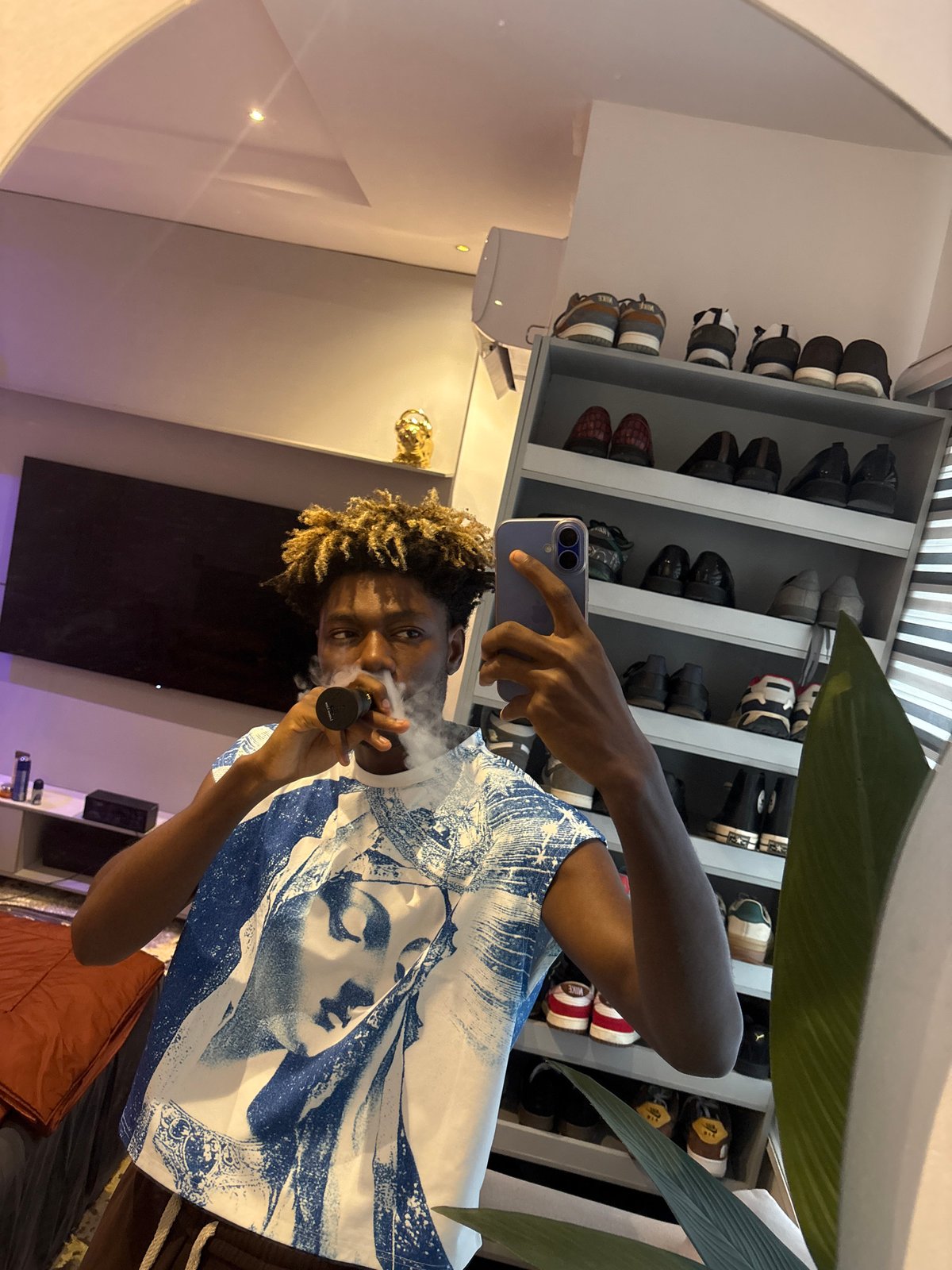 Young man photographed smoking, taking selfies in Nigeria