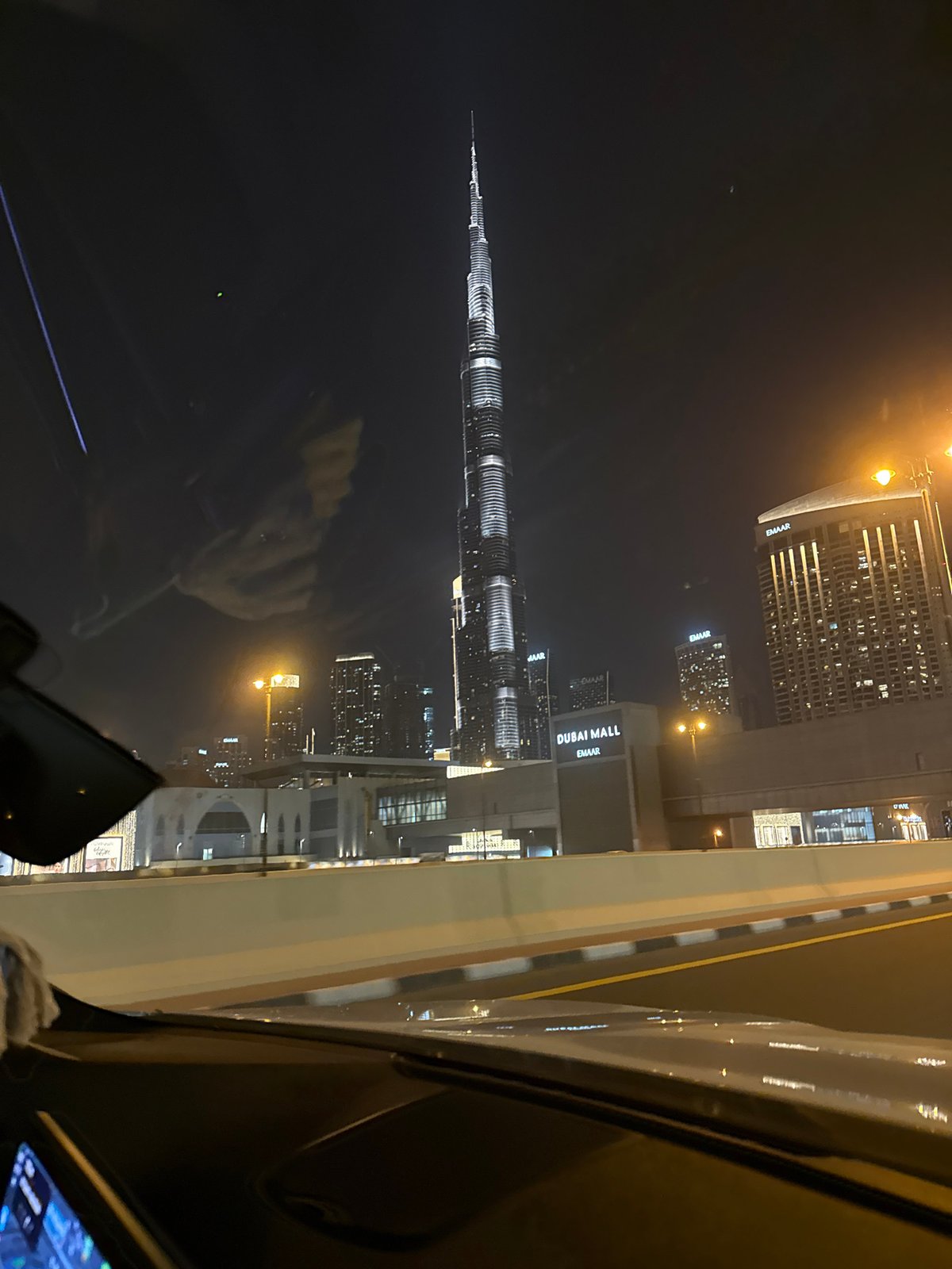 Witness captures Dubai skyline view featuring illuminated Burj Khalifa