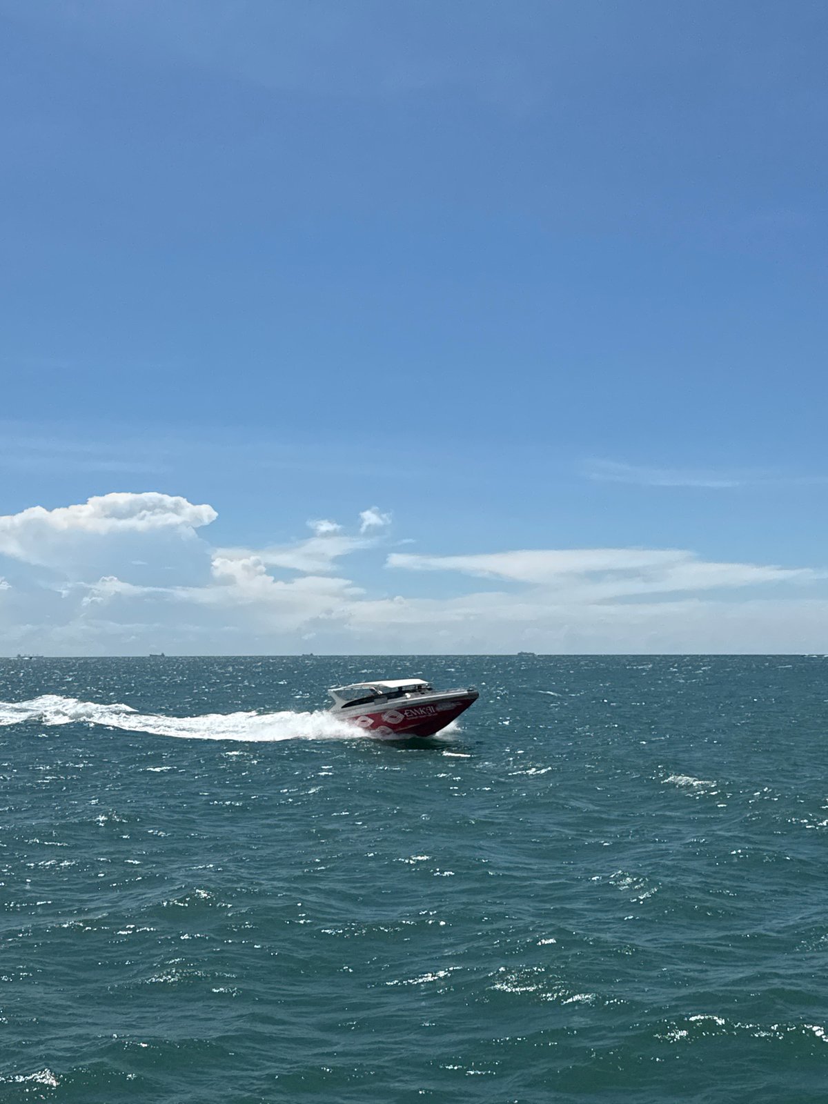 Red and white speedboat spotted crossing waters near Pattaya