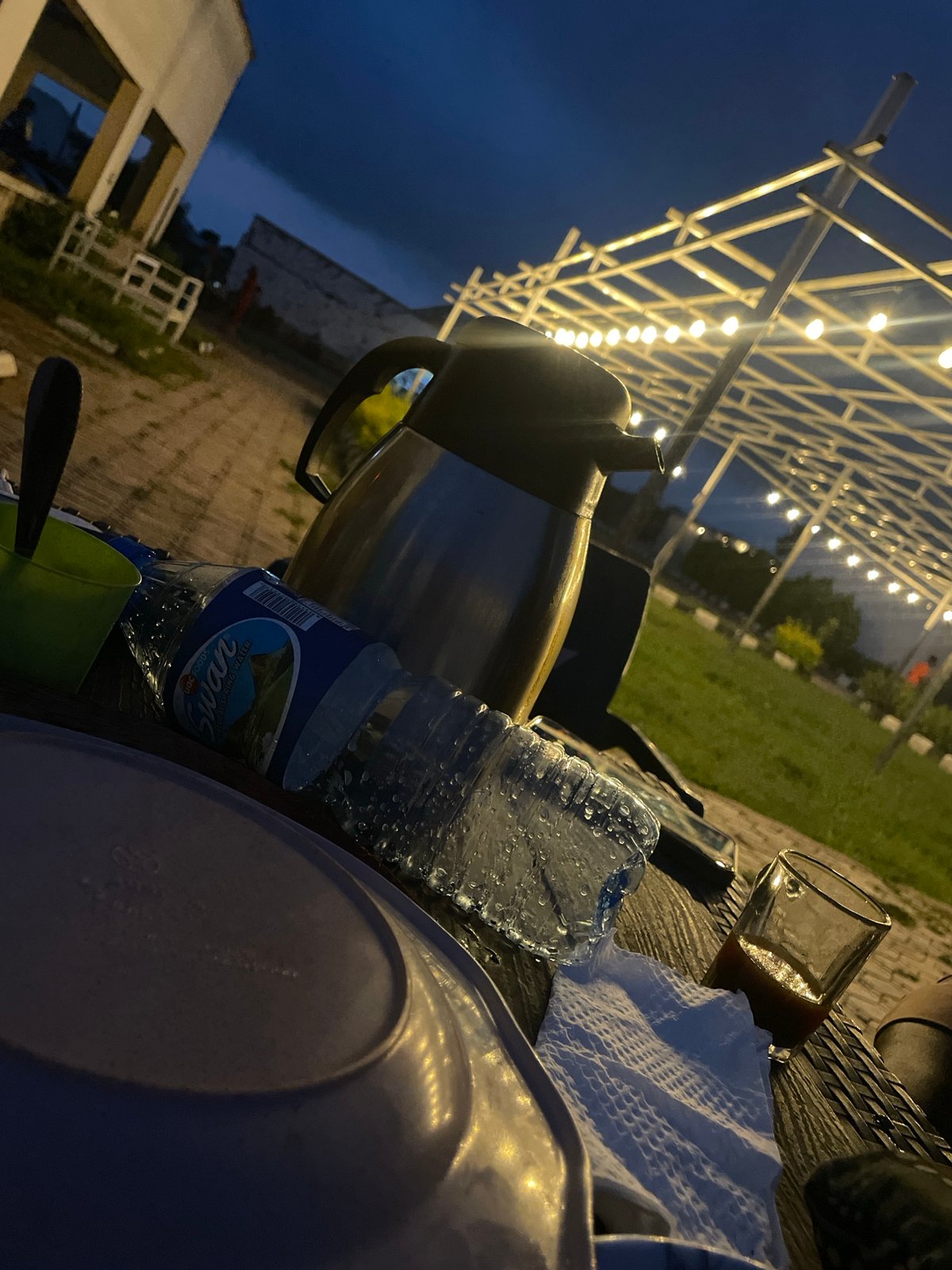 Outdoor cafe in Gura Top glows at dusk and into the night