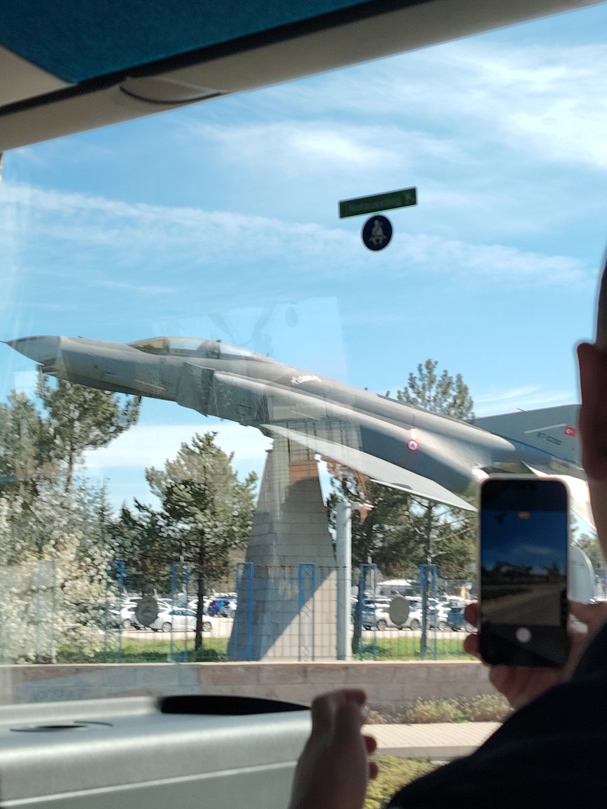 Military jet display viewed from vehicle in Turkey