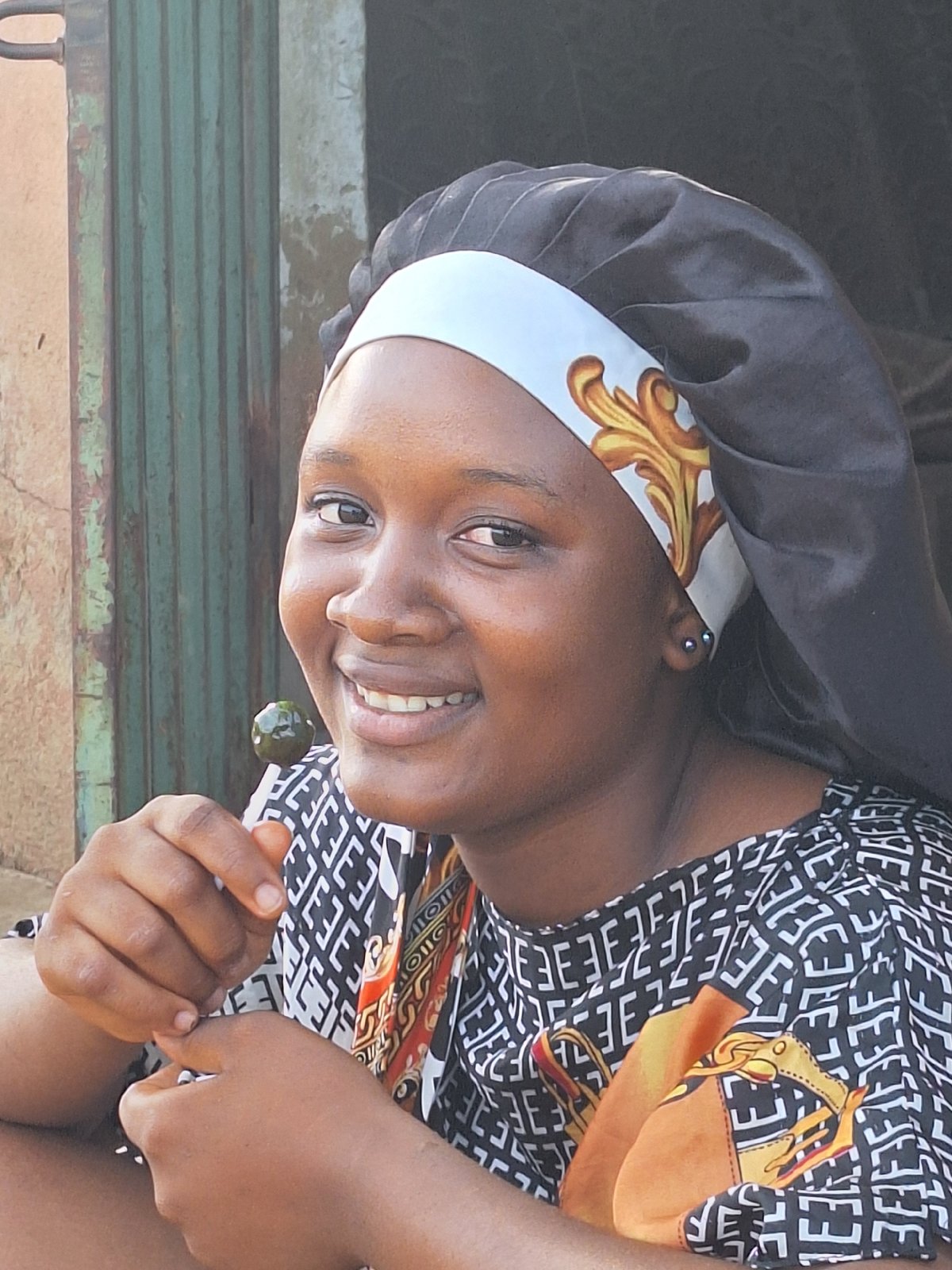 Woman in traditional dress observed across Sabon Tasha locations