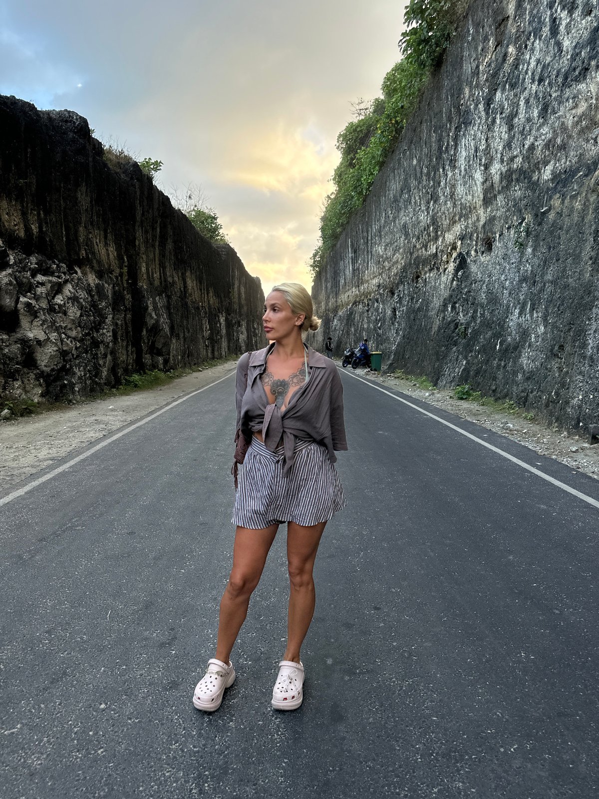 Woman photographed on coastal road in Kuta Selatan, Indonesia