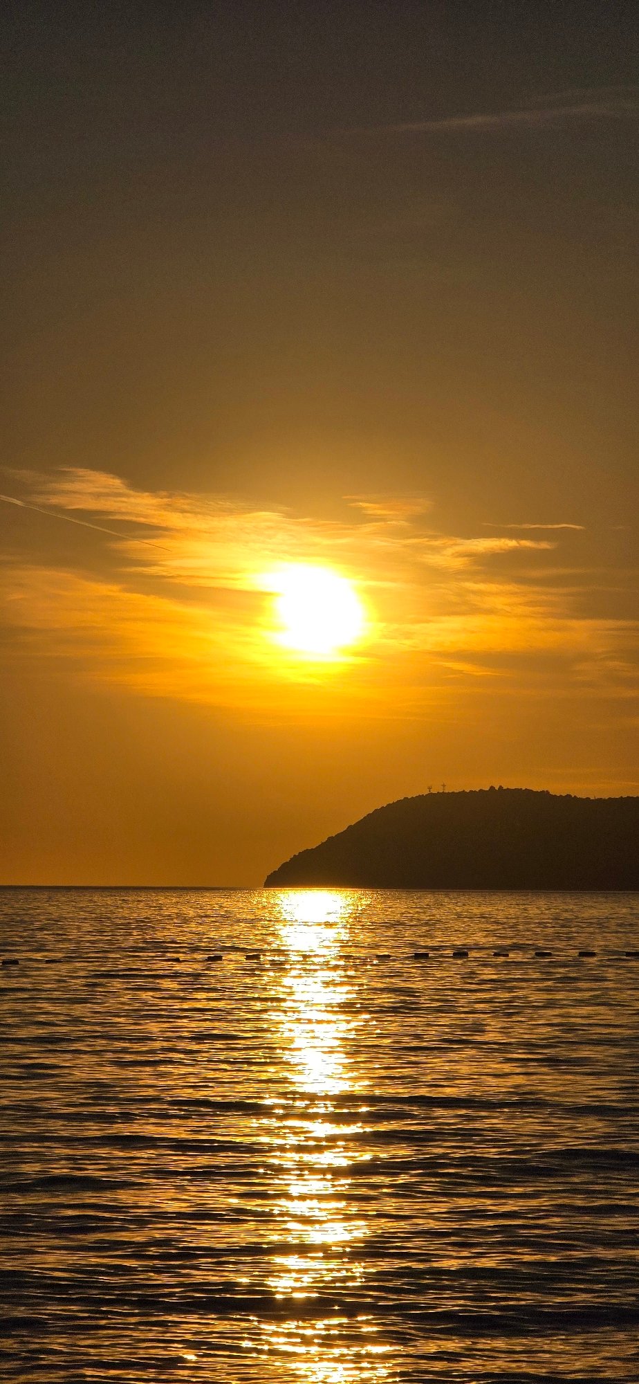 Sunset creates shimmering reflections over Adriatic Sea in Bar
