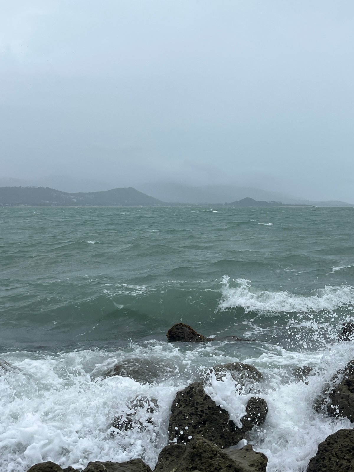 Rough coastal waters breaking over rocks at Ko Samui