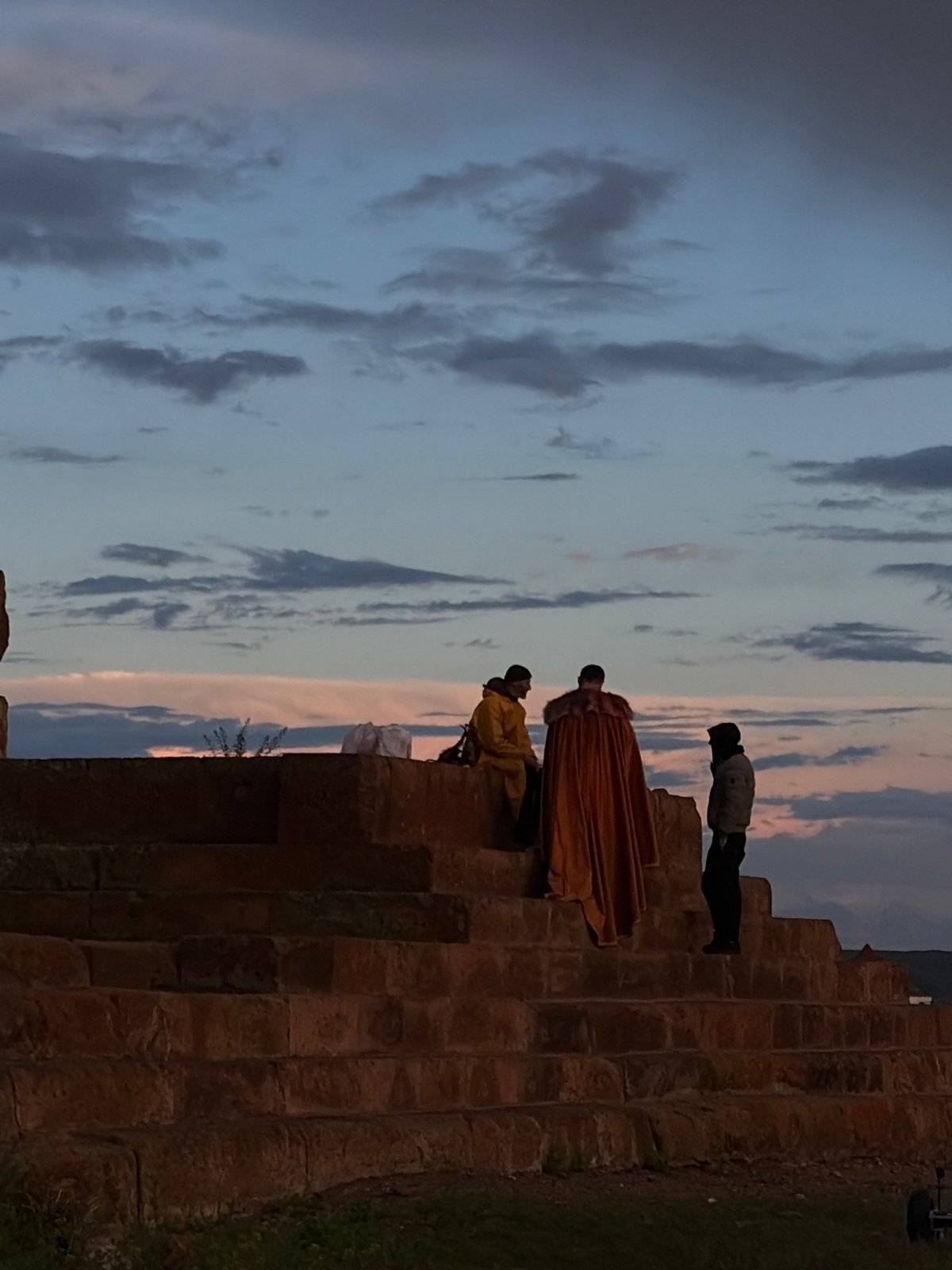 Teal-haired visitor explores historic ruins and landscapes in Anipemza