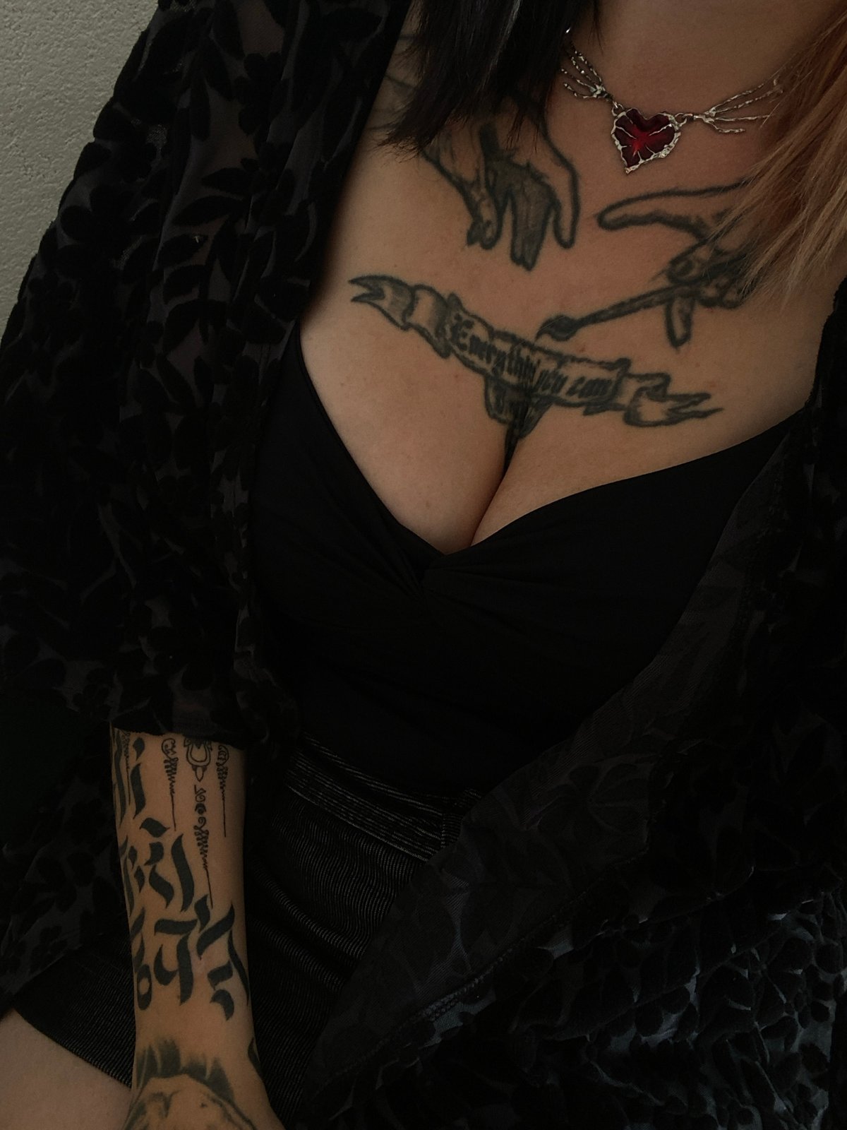 Tattooed individual photographed in close-up in Kunje, Montenegro