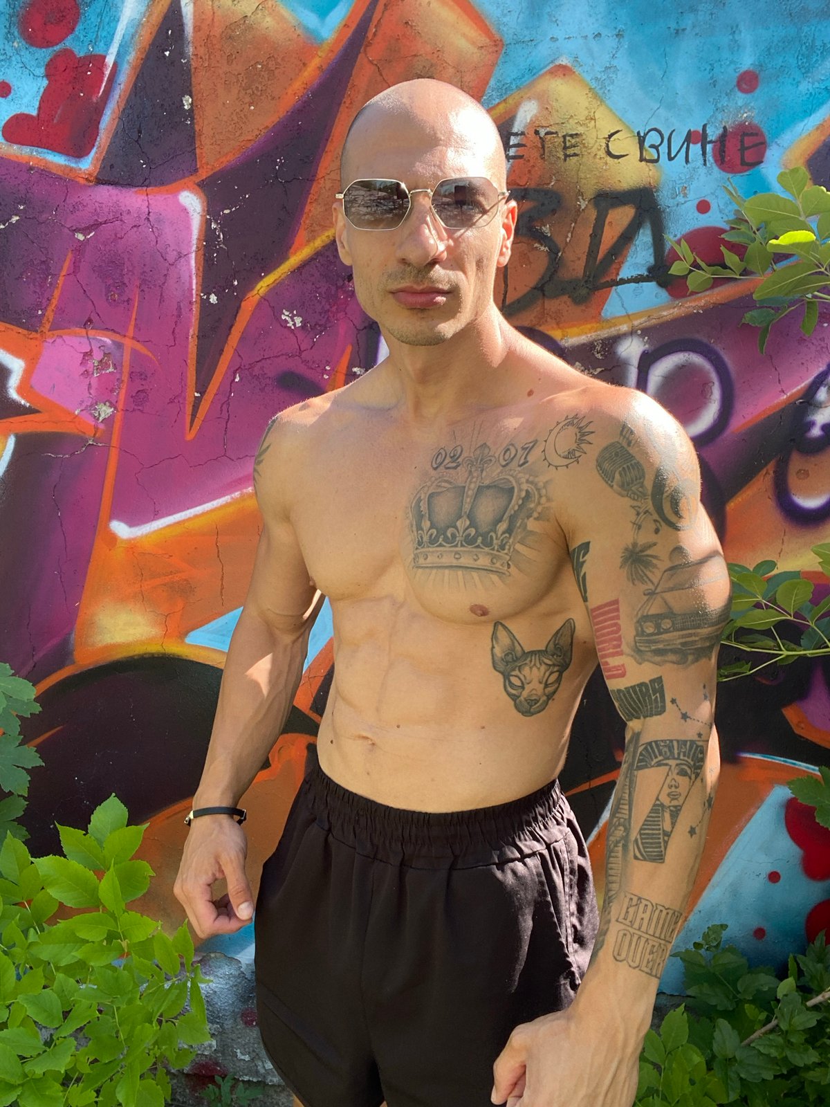 Tattooed man poses at abandoned locations in Pleven, Bulgaria