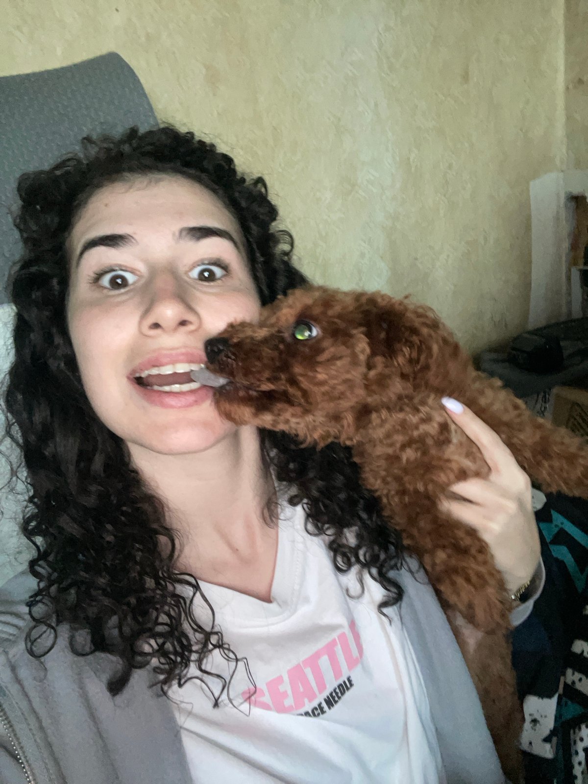 Woman plays with toy gun in Sofia apartment