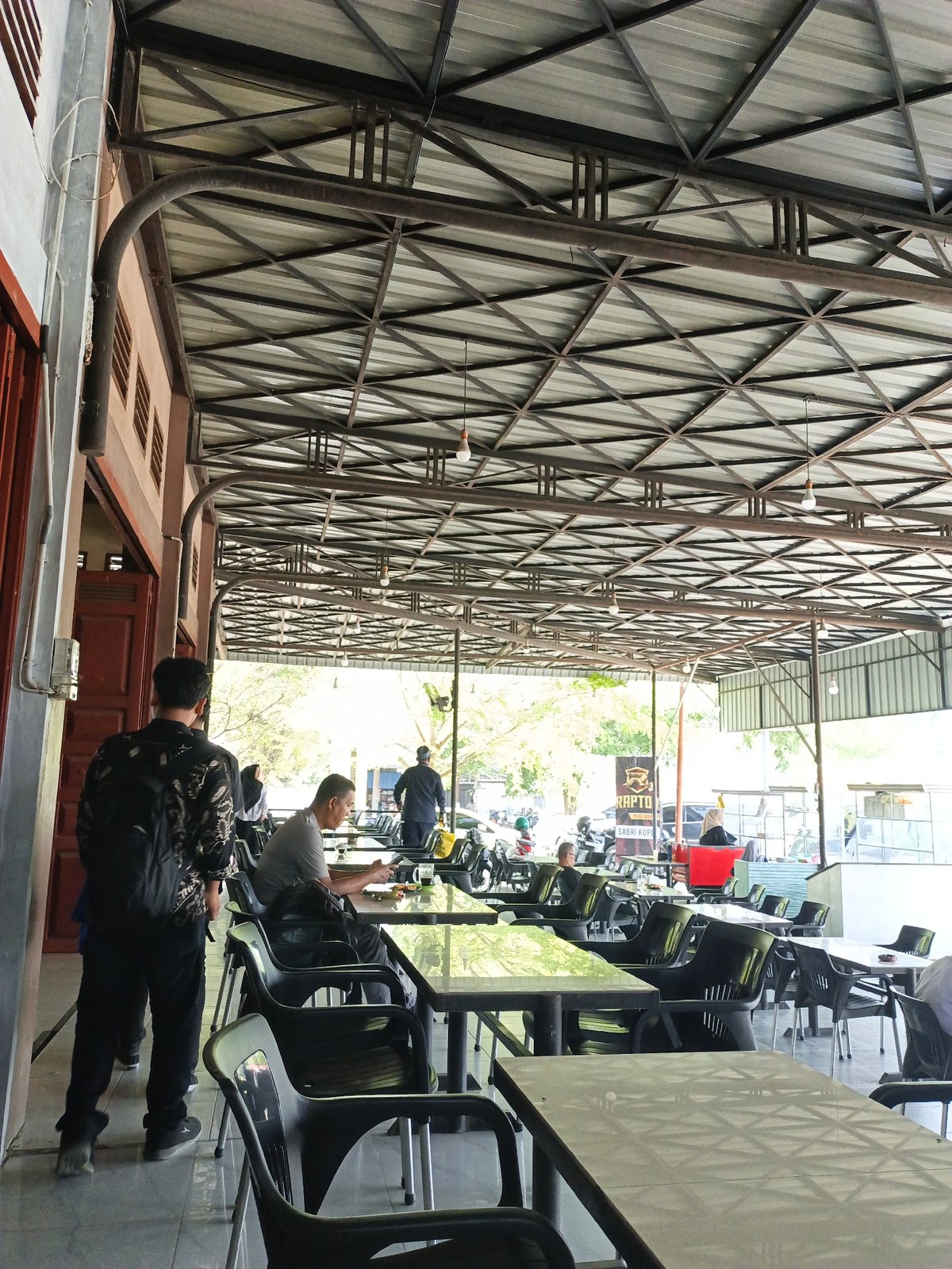 Daytime cafe scene documented in Lhokseumawe, Indonesia