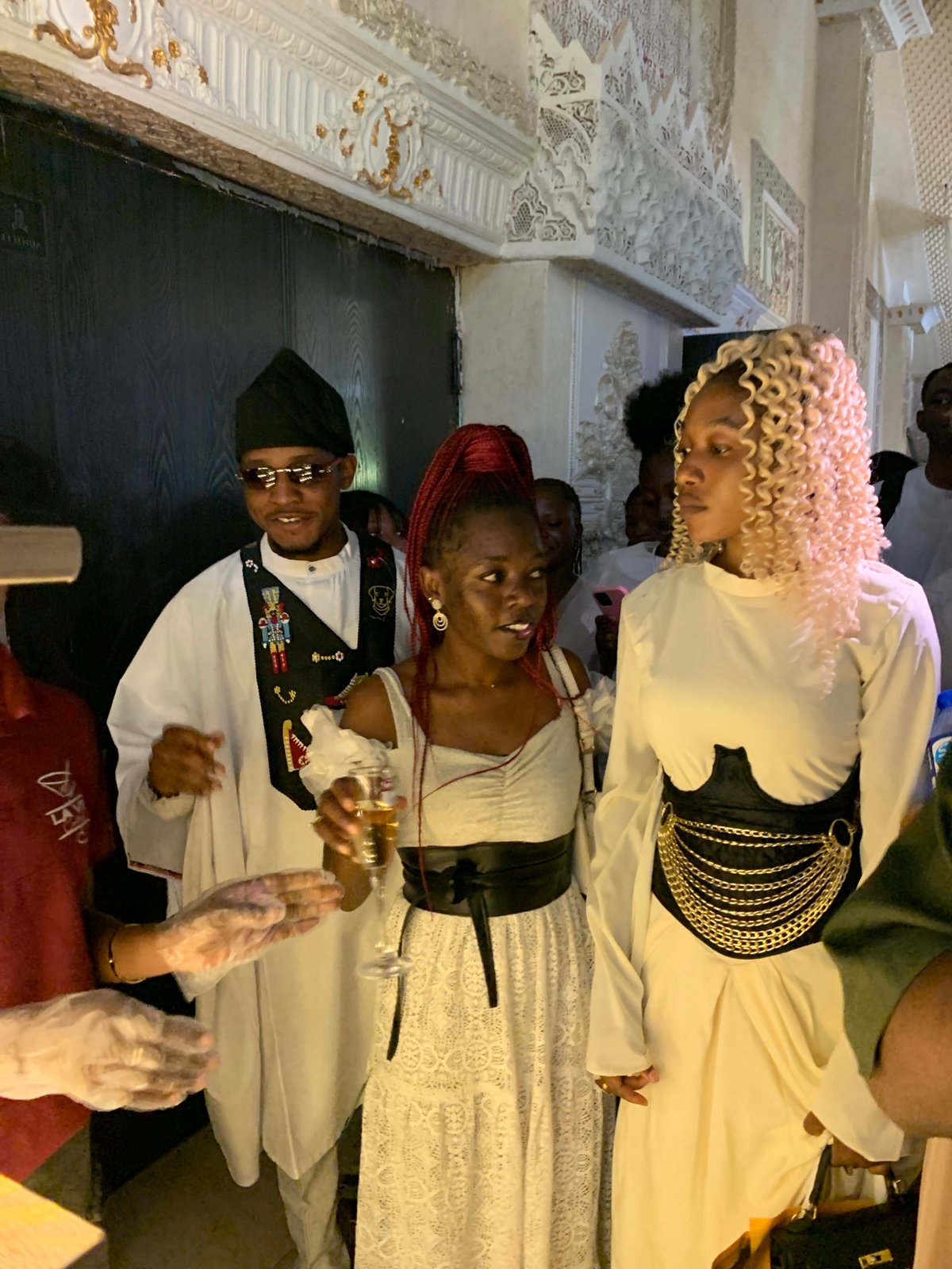 Indoor celebration in Jos with champagne displays and dressed-up guests