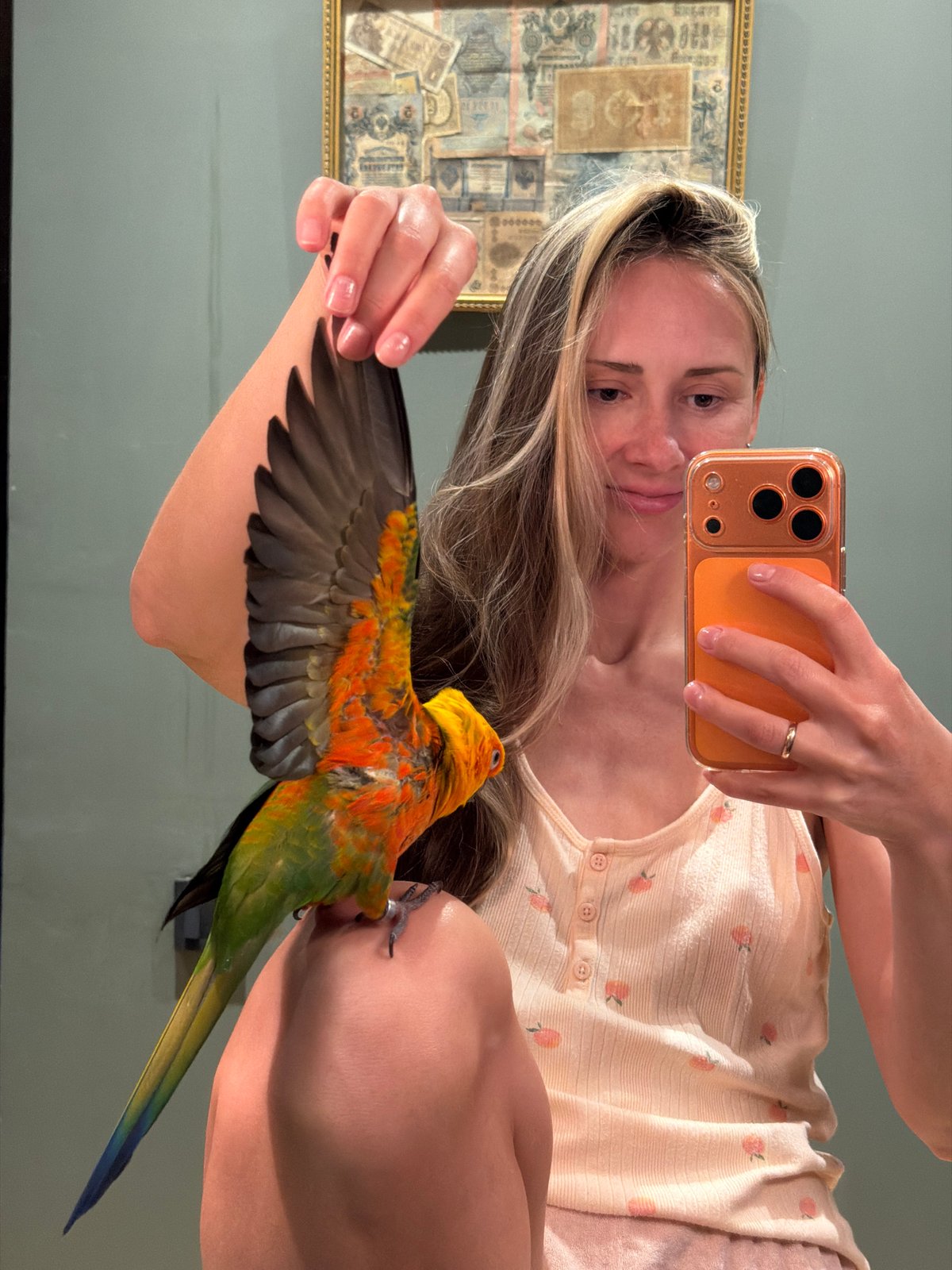 Woman takes selfies with parrot while cooking in Khimki
