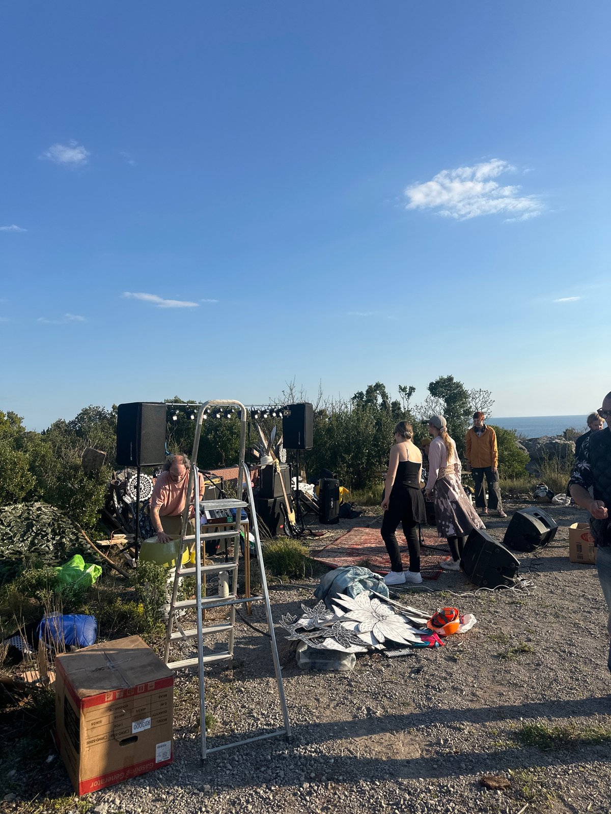 Outdoor gathering with fires, scattered objects documented across Montenegro villages