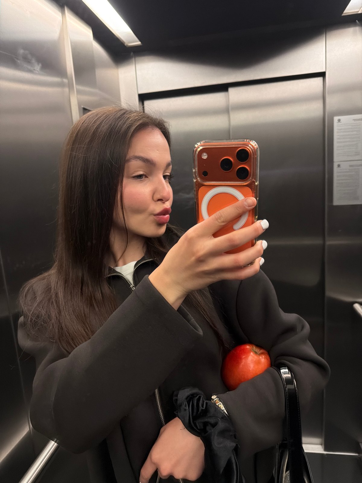 Woman Takes Multiple Selfies in Sofia Elevator