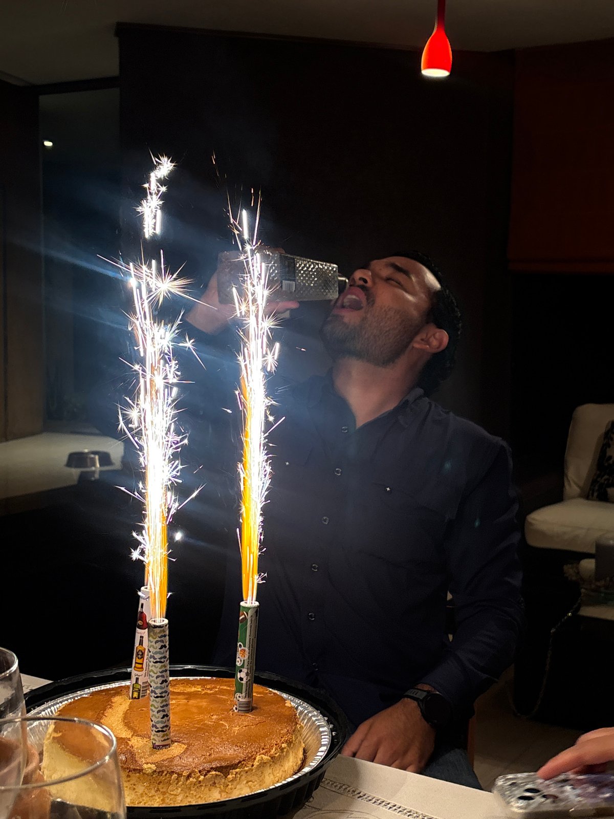 Man celebrates with sparkler cake in Puebla, Mexico