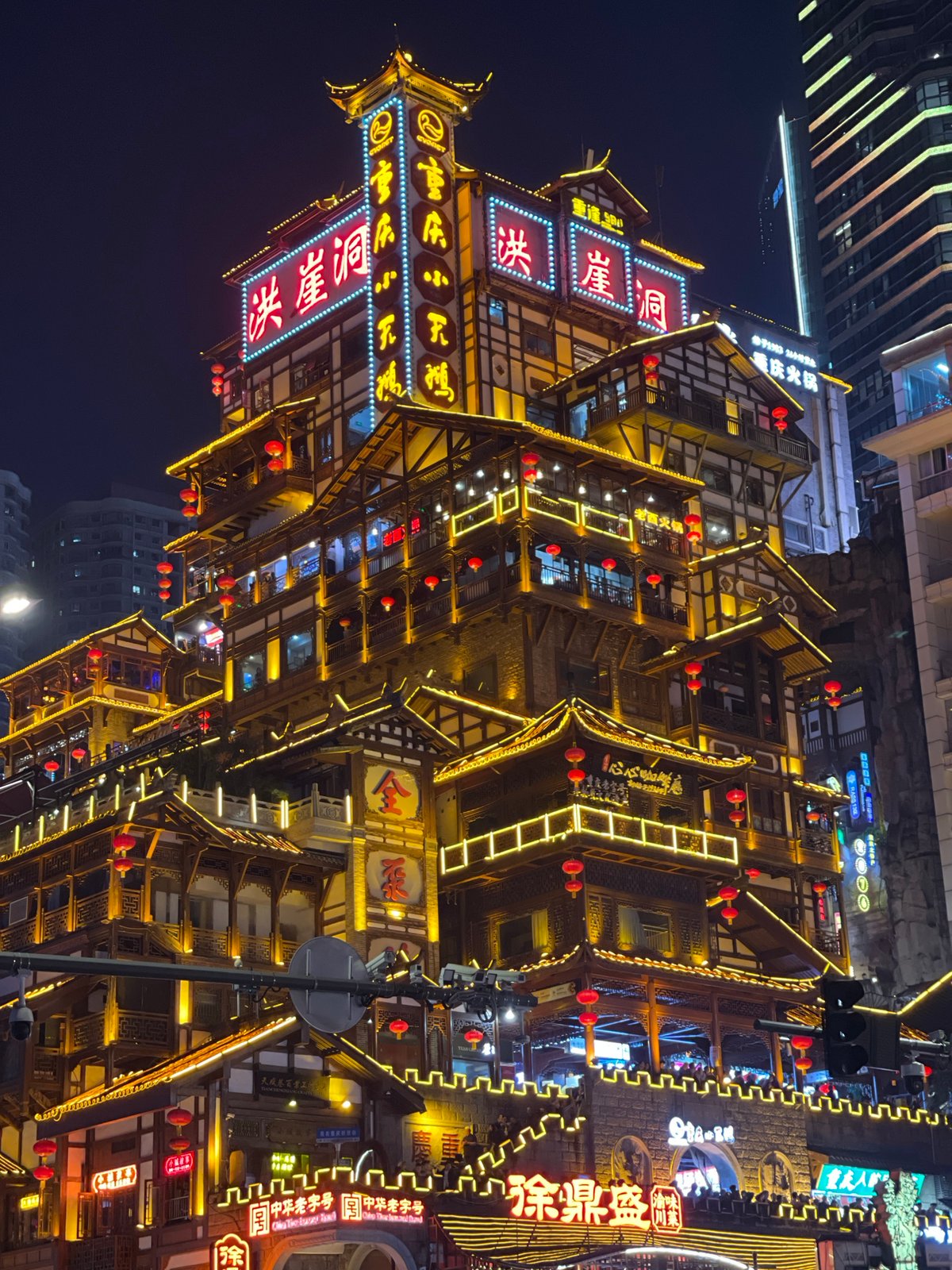 Crowds gather at Chongqing's illuminated Hongyadong tourist complex