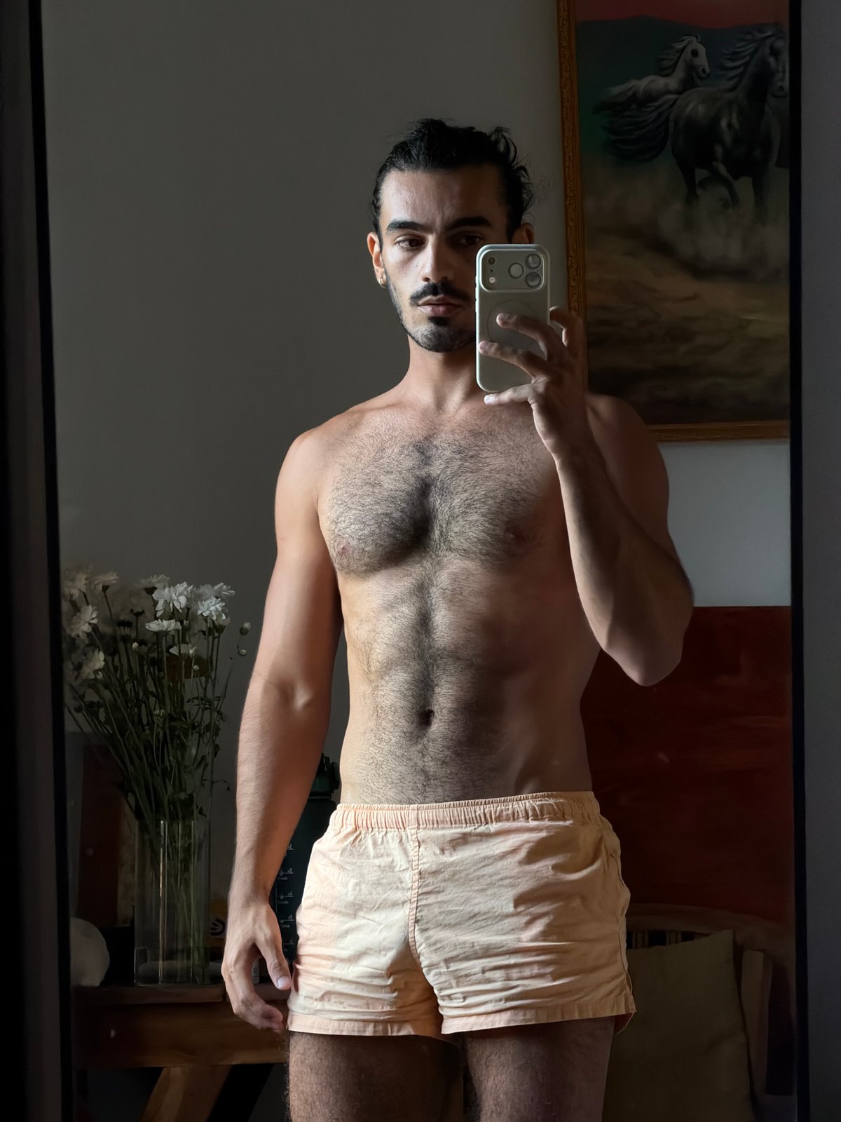 Man takes mirror selfie indoors in North Kuta