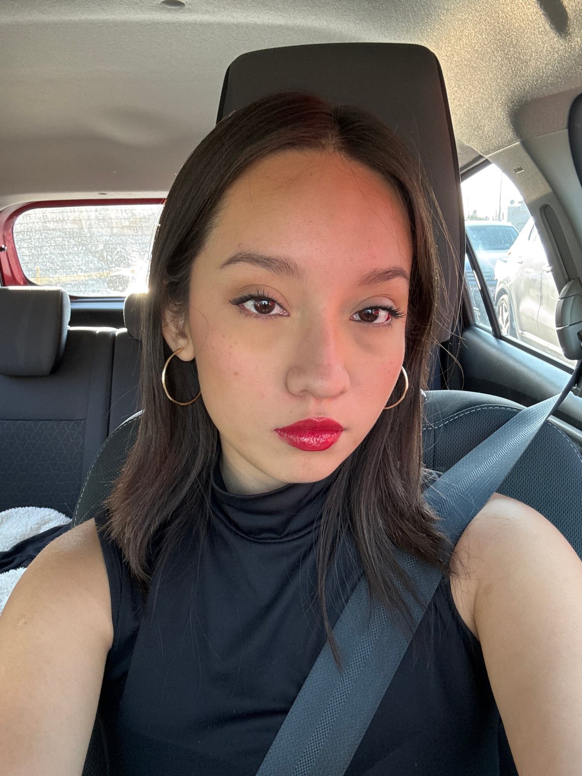 Woman takes car selfie in Puebla, Mexico