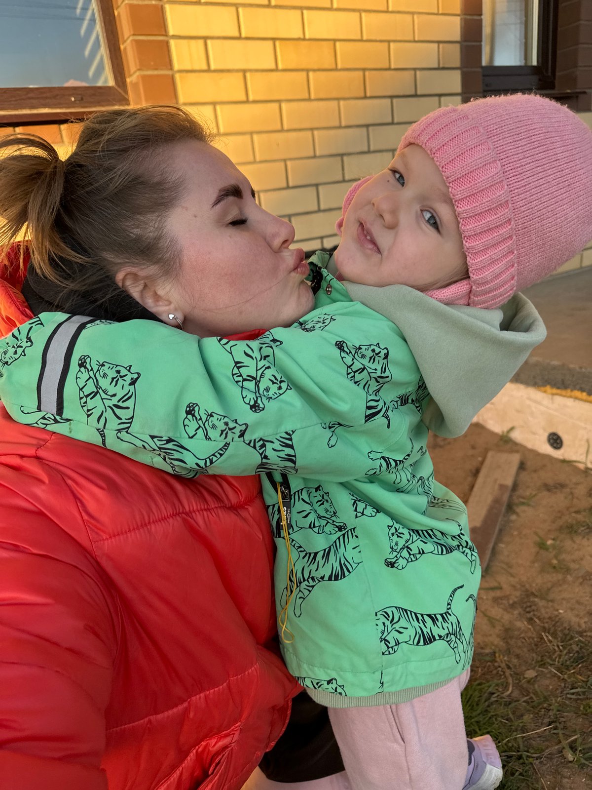 Woman and child spend afternoon outdoors in Russian village