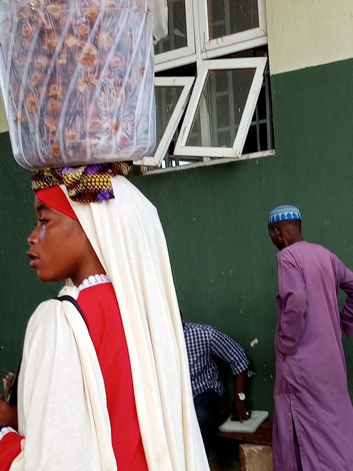 Street food vendors and buyers gather at an outdoor market