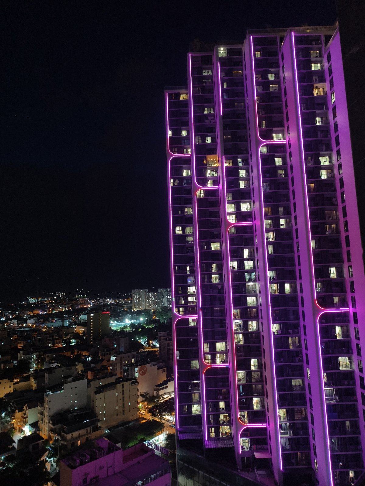 Colorful nighttime city skyline observed from multiple angles
