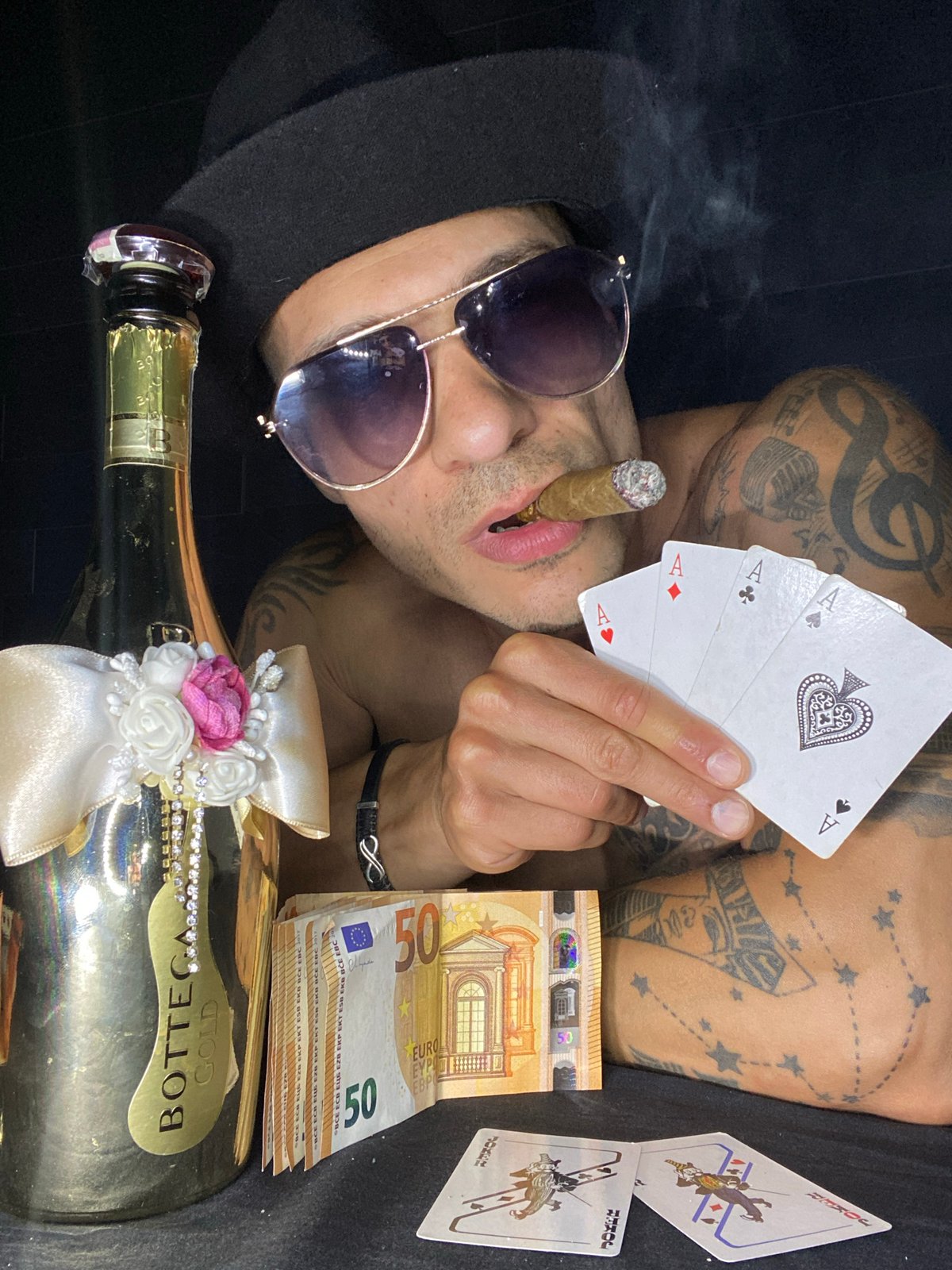 Cards, cash, and Bottega Gold in a styled Pleven setup