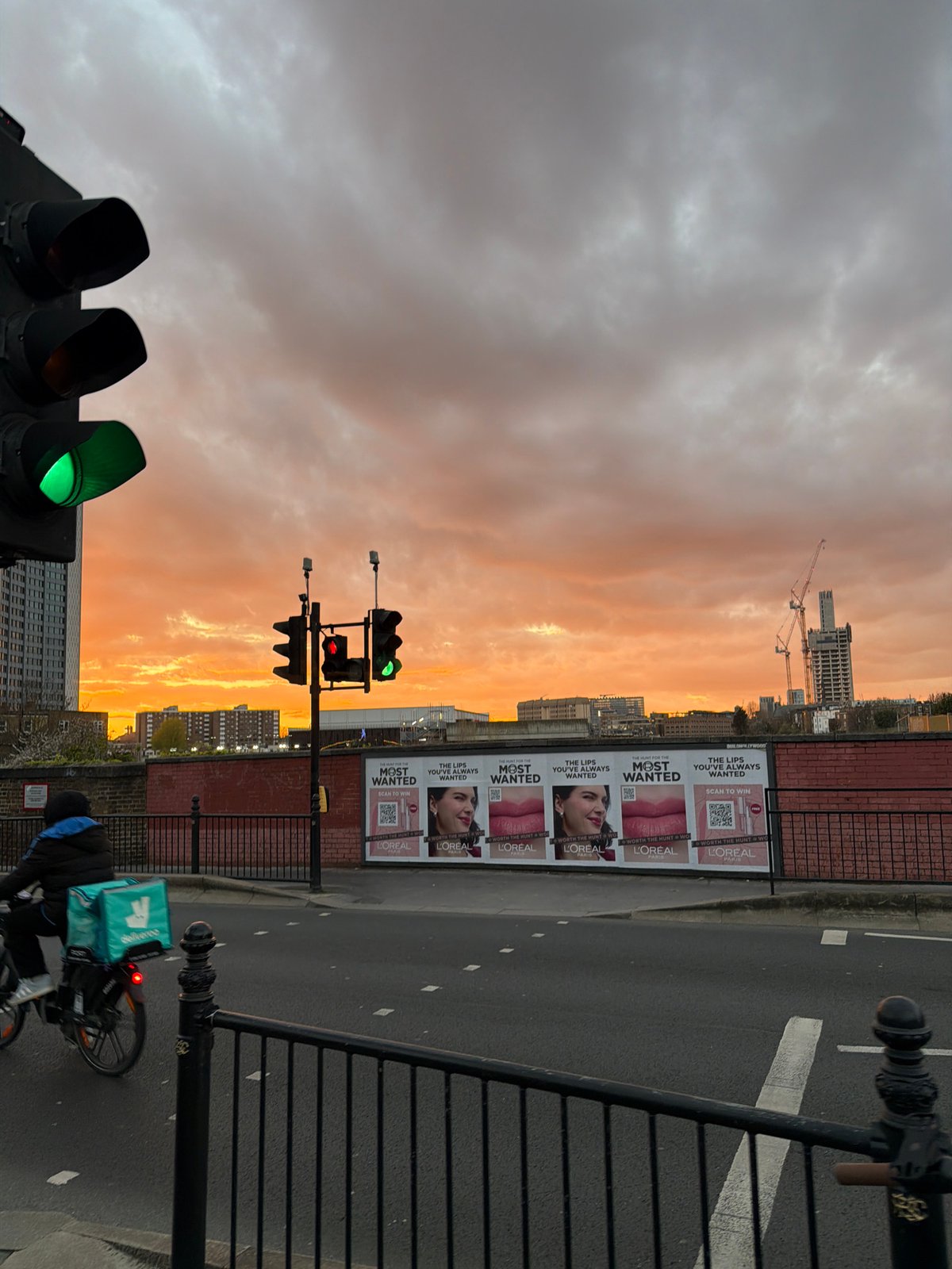 London street captured under dramatic orange sunset skies