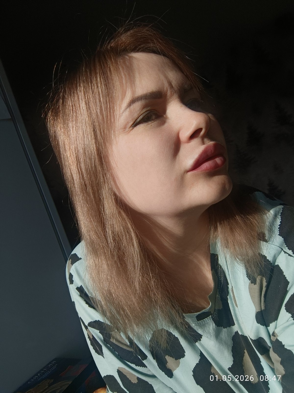 Woman photographed in morning sunlight, Chaikovsky kitchen scene