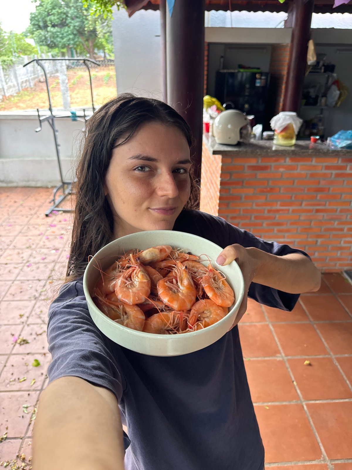 Woman with shrimp bowls, kitten in blanket captured in Mũi Né