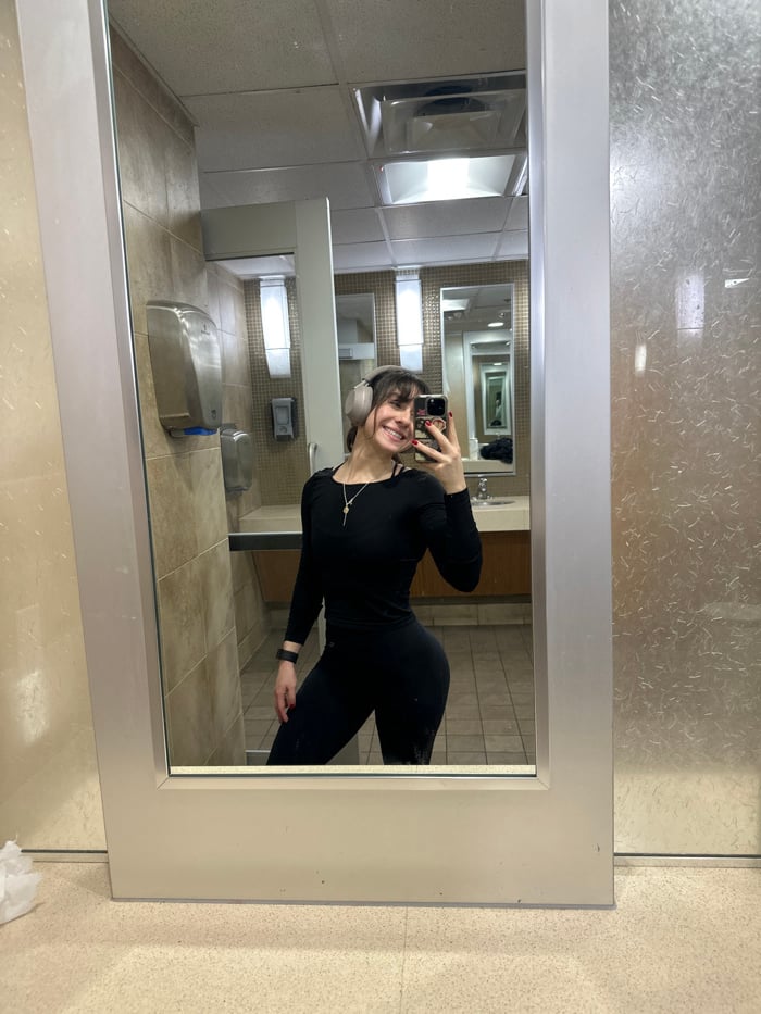 Woman takes selfie in Santa Monica public restroom