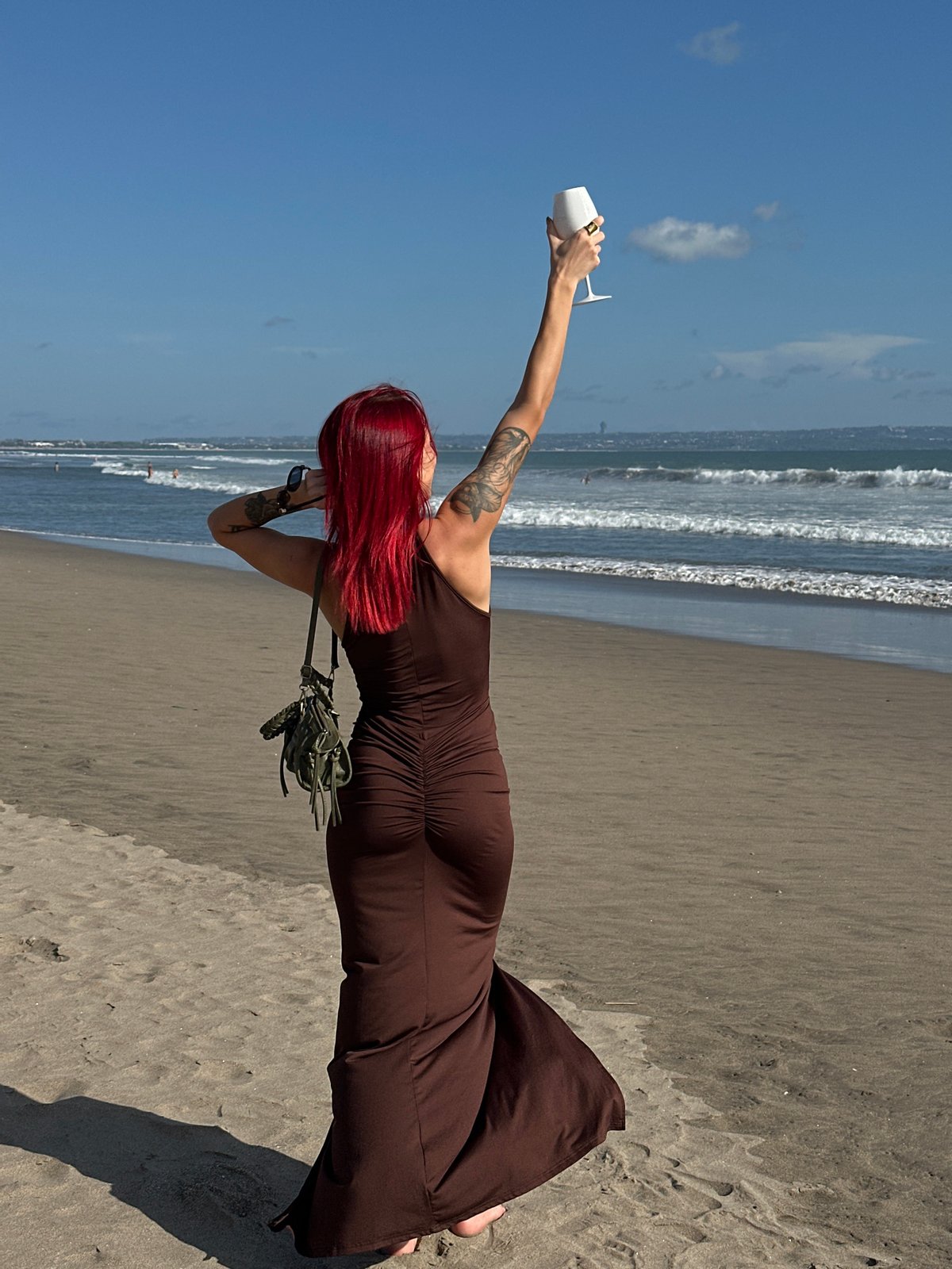 Woman poses for photos on stone pathway in North Kuta