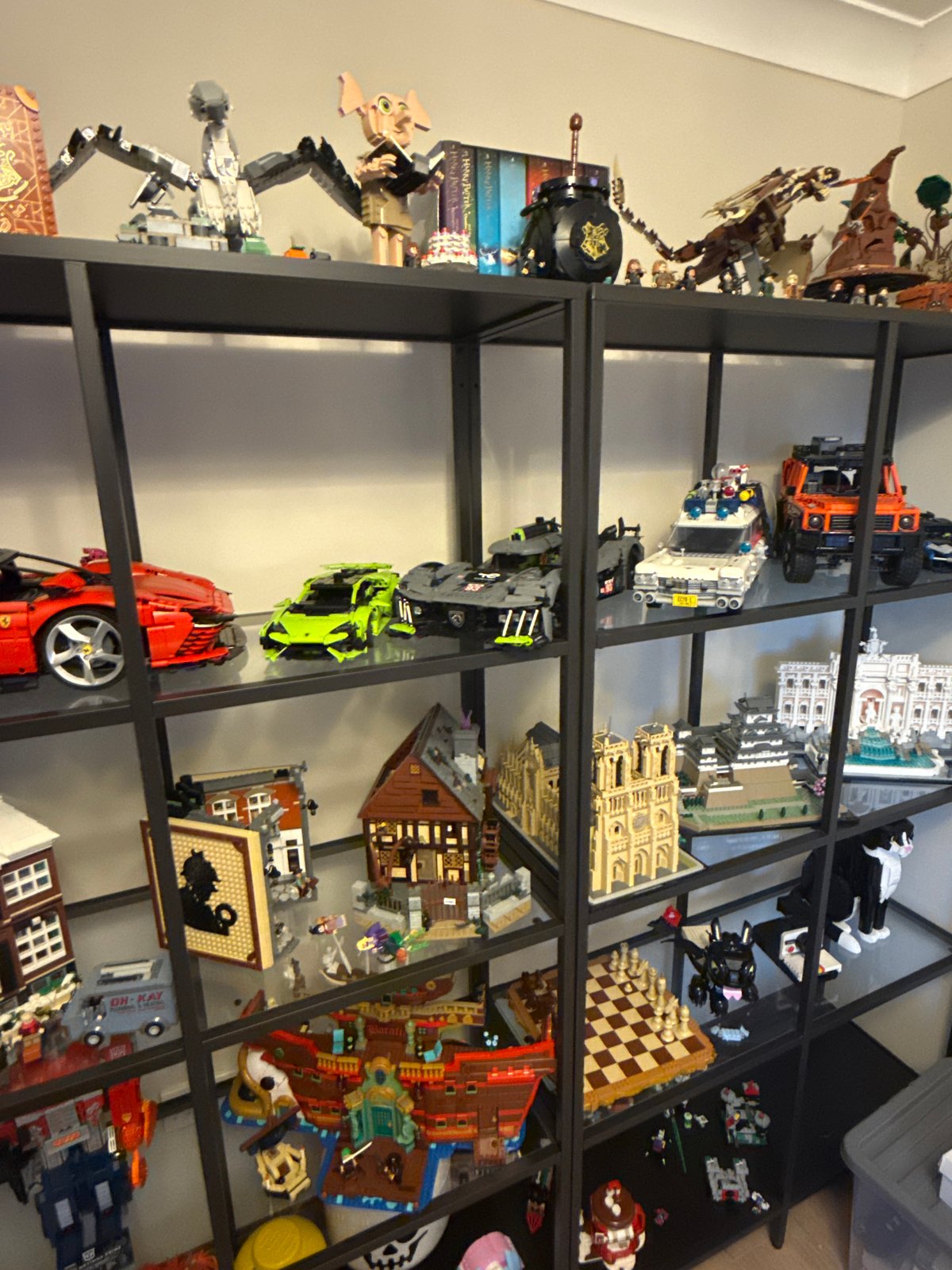 Lego collection on black metal shelves, Newcastle-under-Lyme