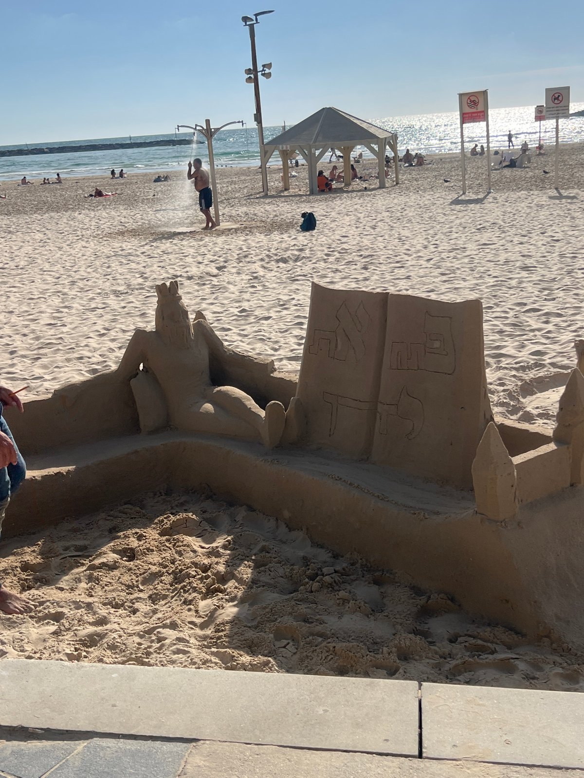 Tel Aviv beach scenes: sand sculptures, volleyball, casual afternoon
