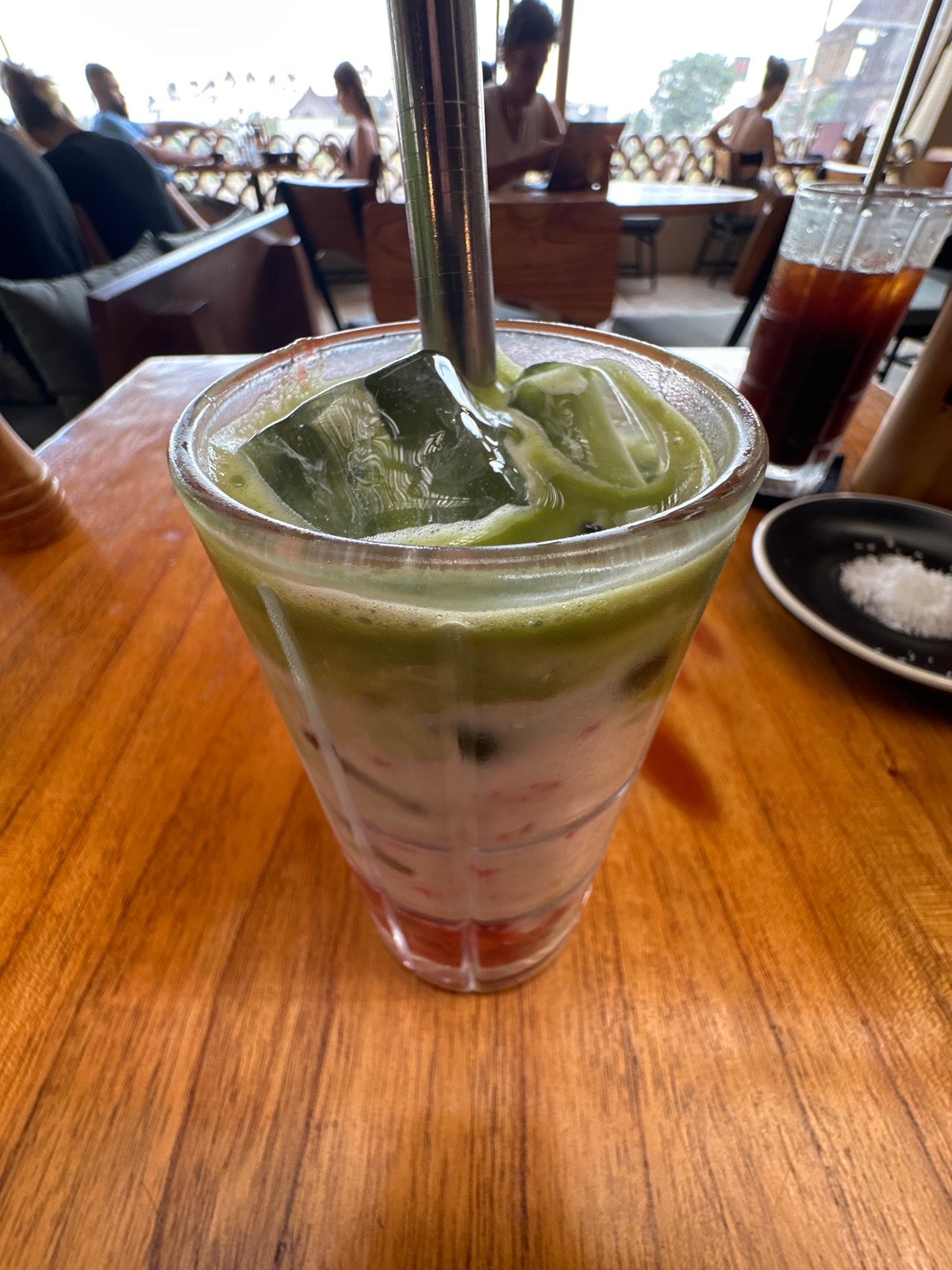 Iced matcha latte documented at Indonesian café