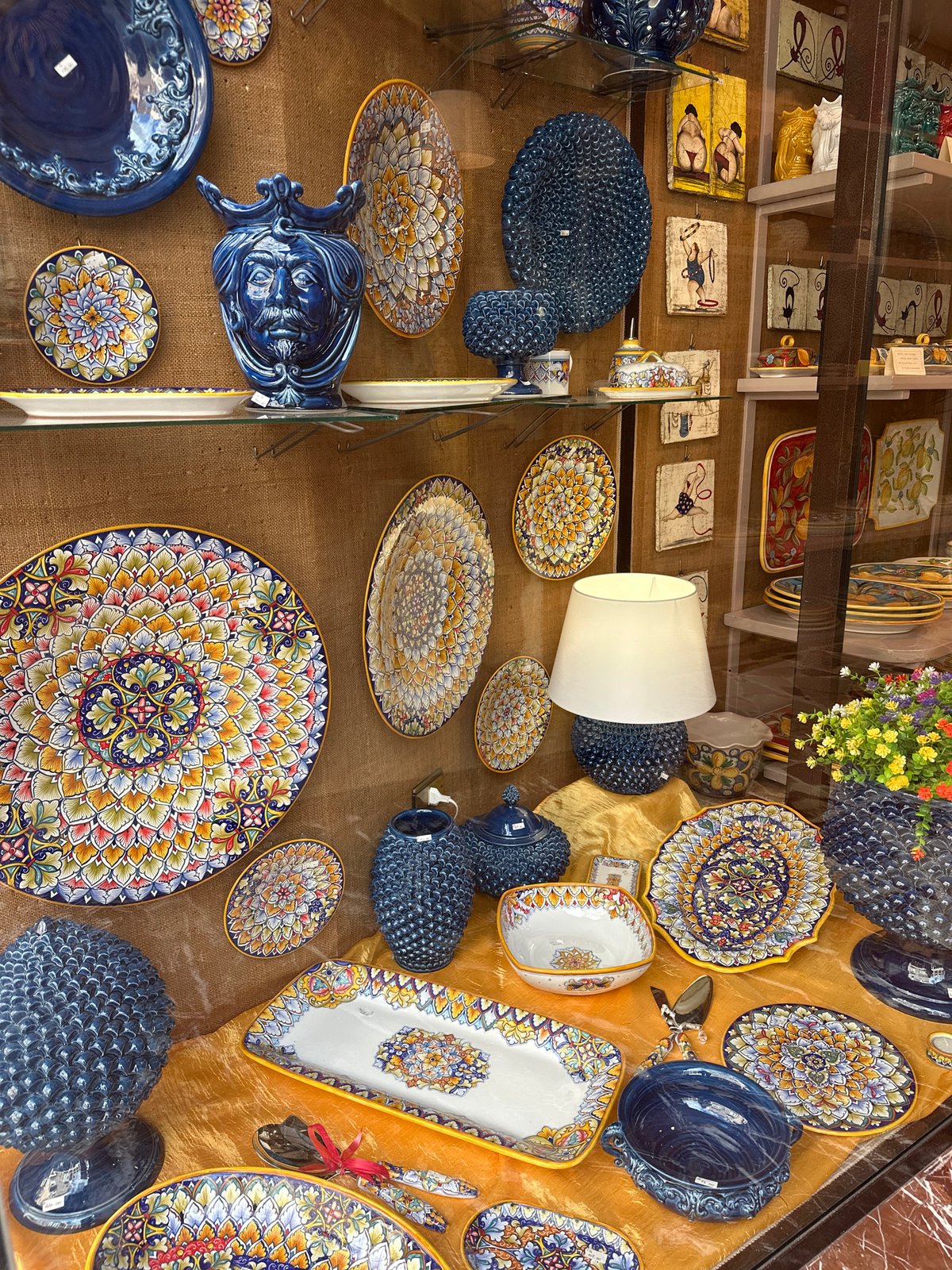 Ceramic pottery display observed in Taormina shop window