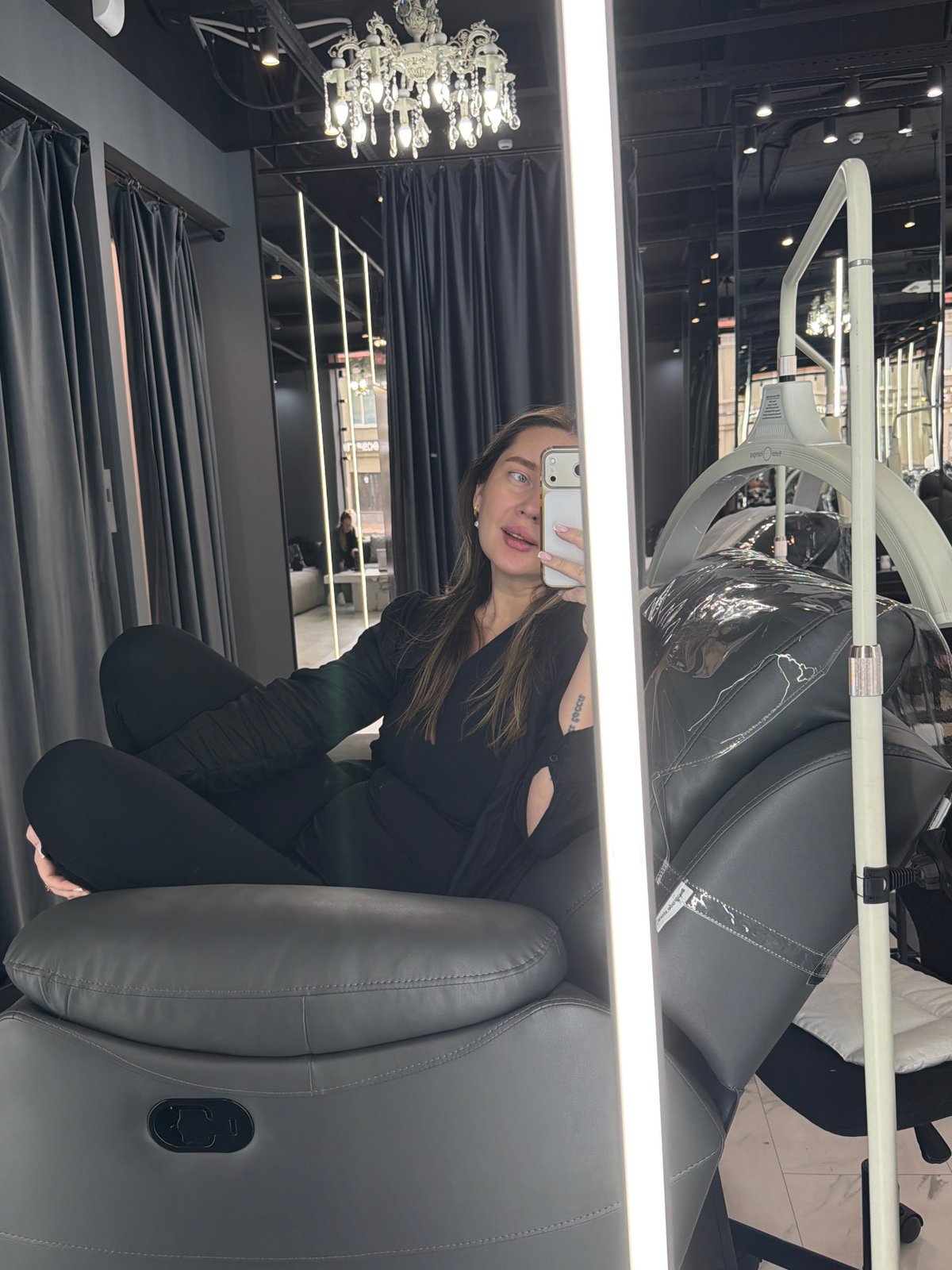 Woman takes selfie in upscale Moscow interior