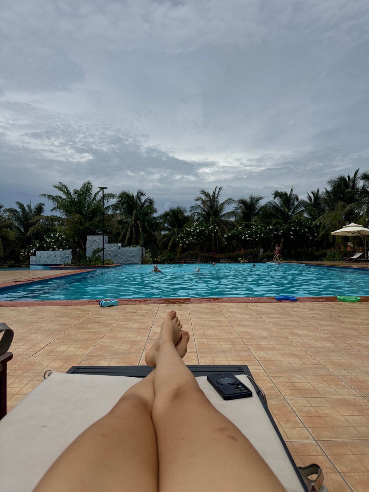 Poolside relaxation captured at tropical Vietnam resort