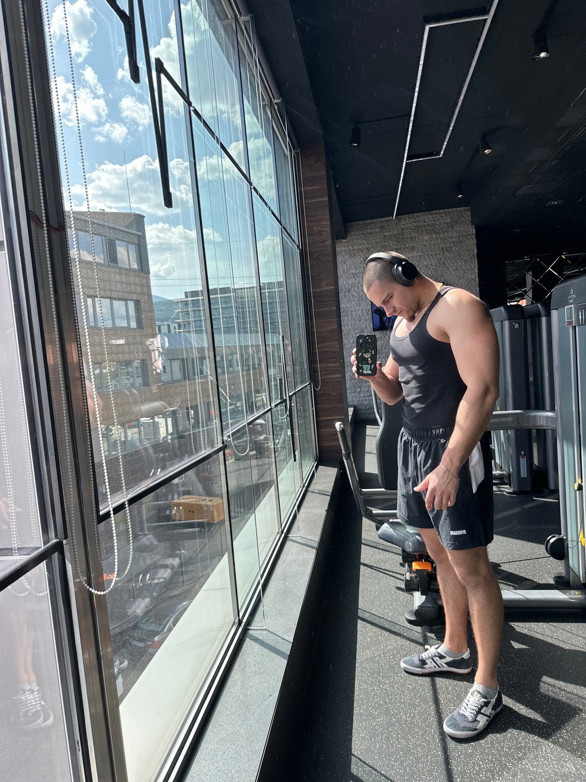 Man checks smartphone at Sofia gym facility