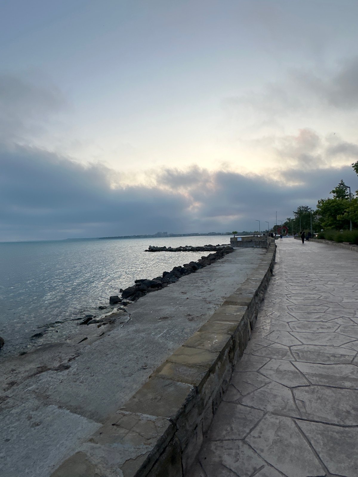 Overcast evening captured along coastal promenade walkway