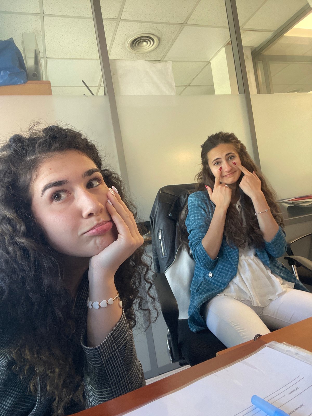 Two women share office break with selfies, snacks in Sofia