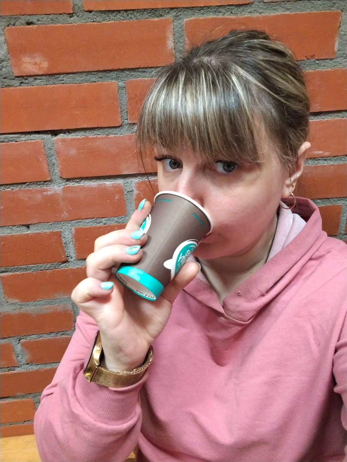Woman drinks coffee, reviews documents in Шебunino, Russia