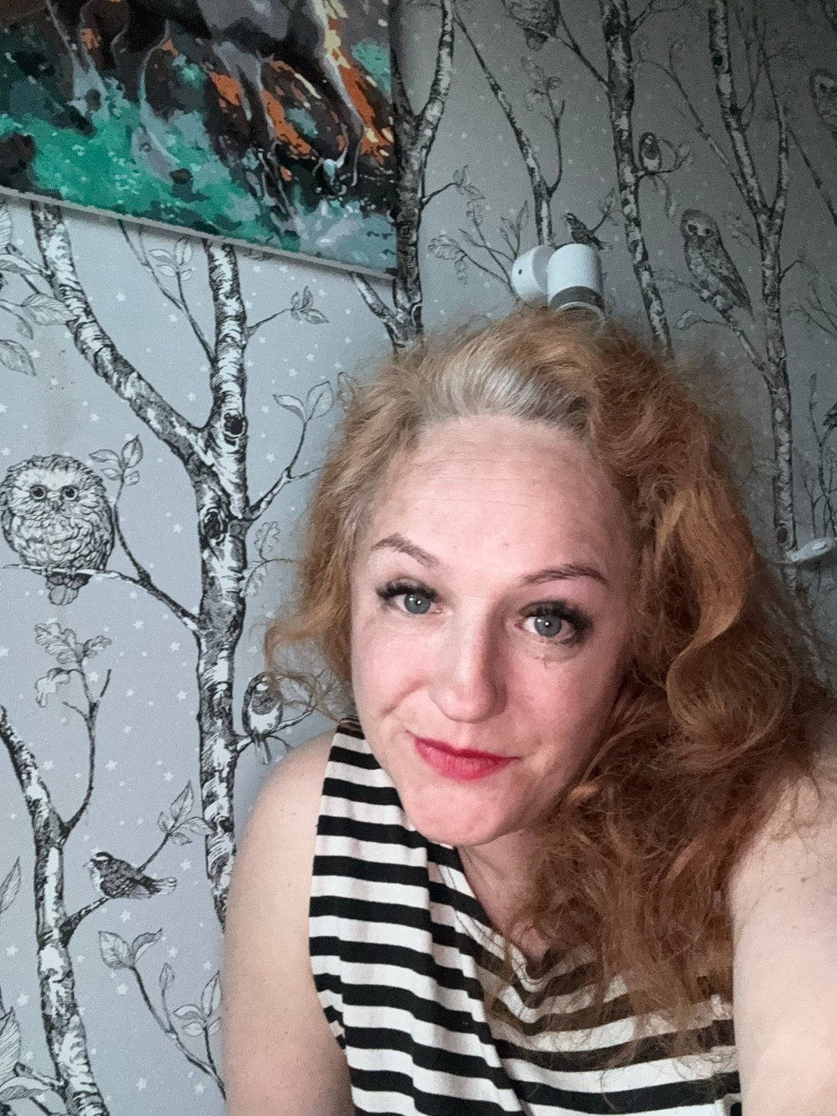 Woman takes relaxed indoor selfies in Chaikovsky, Russia