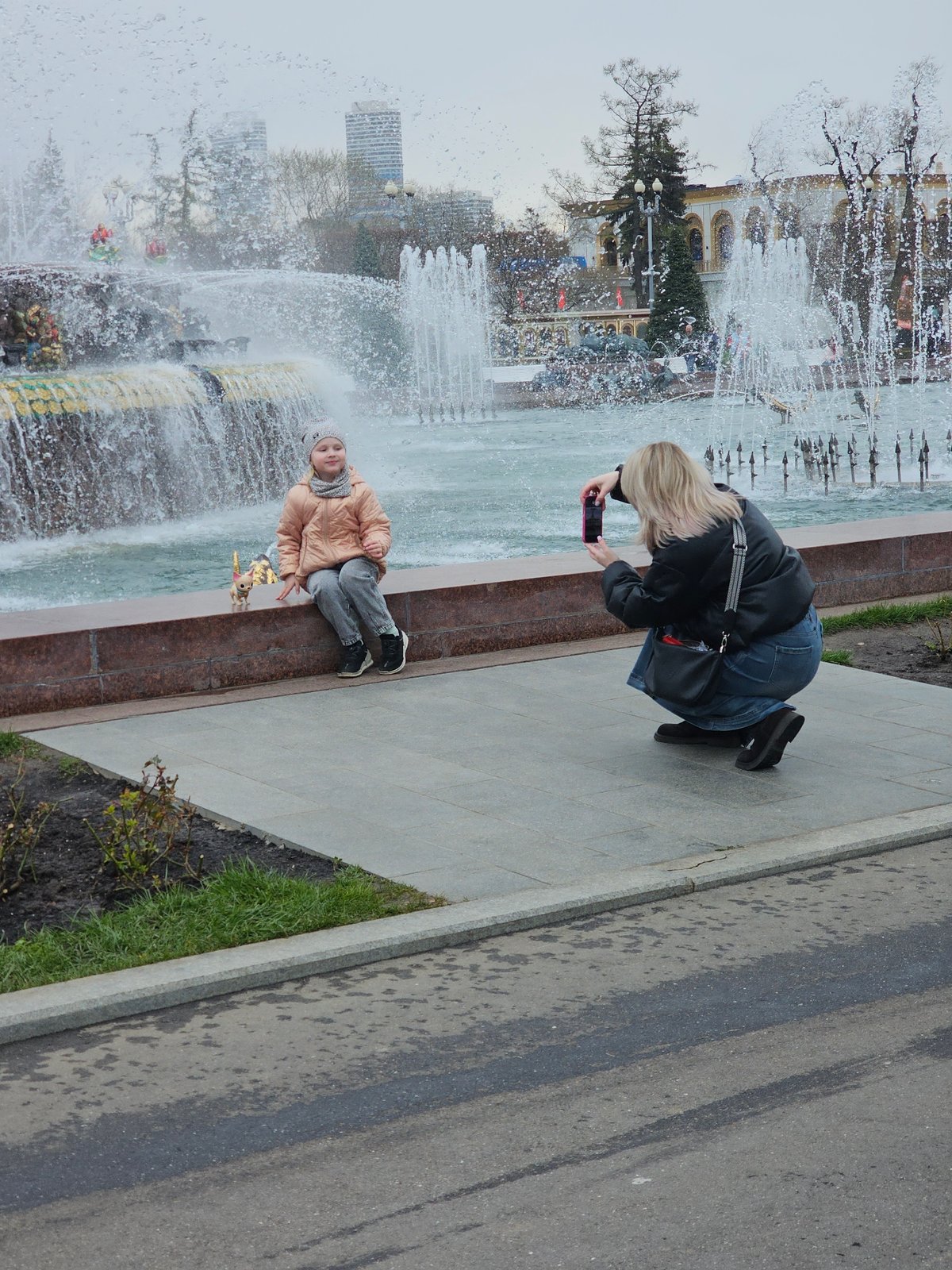 Morning visitors enjoy VDNKh park attractions in Moscow