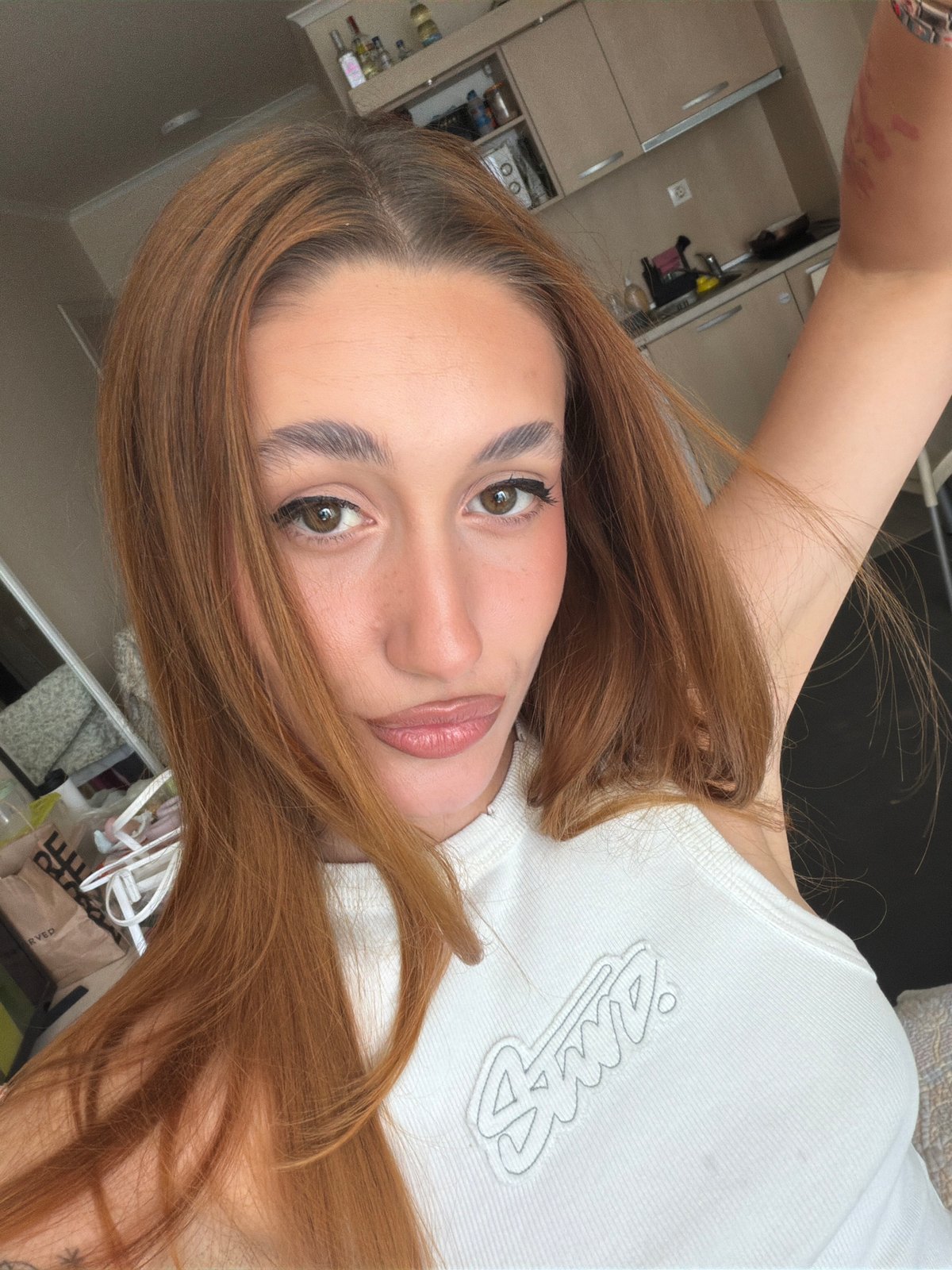 Woman takes multiple selfies across indoor locations in Sofia