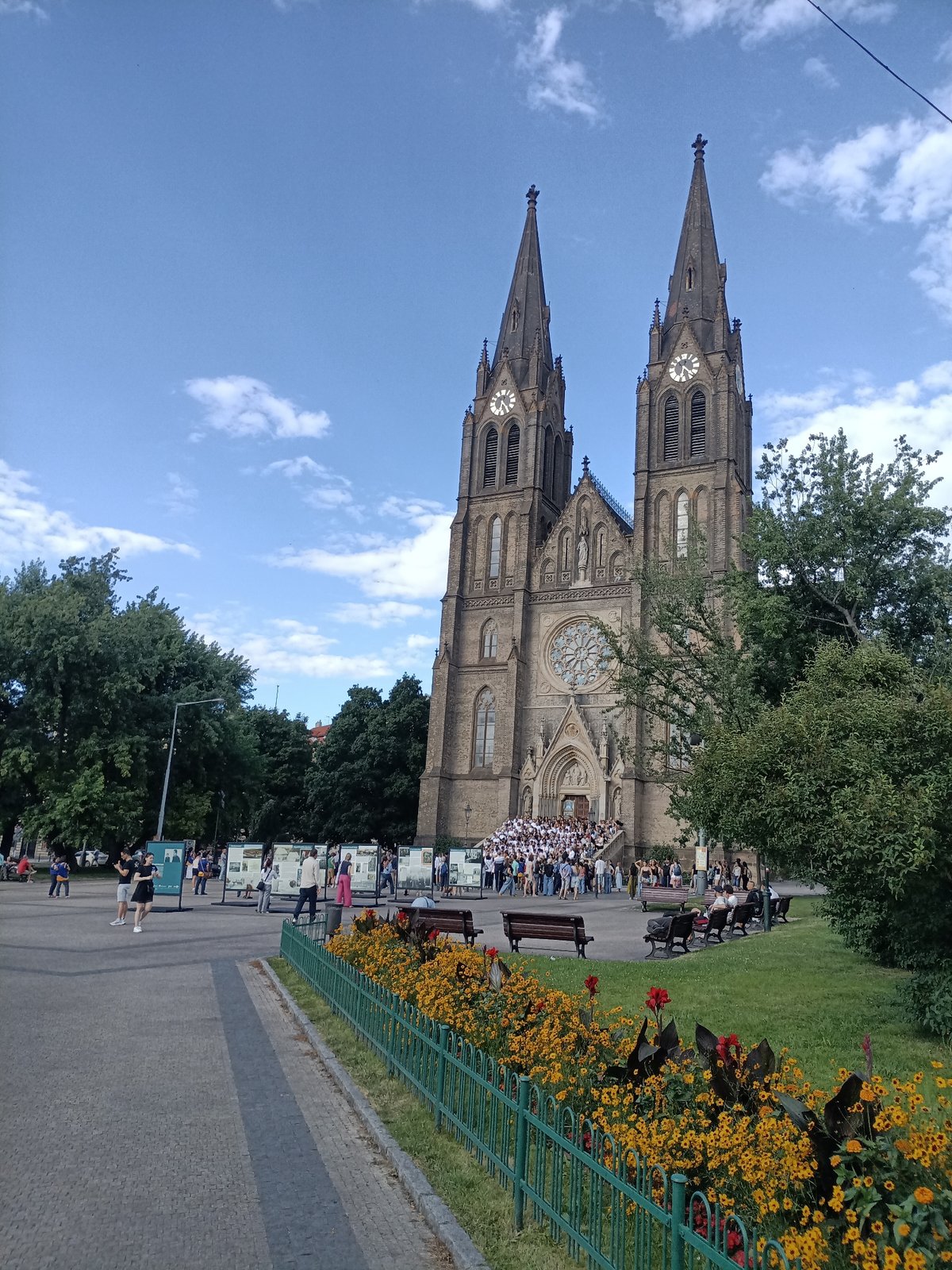 Crowd fills the steps of Vyšehrad's Gothic basilica in Prague