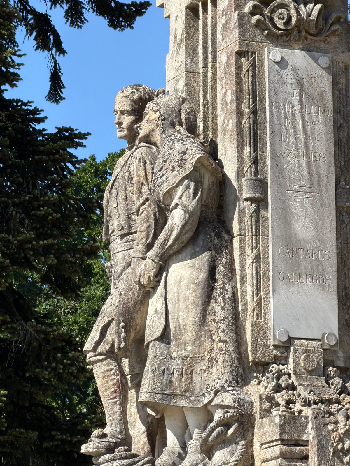 Tourists document stone monuments, pergola in Santiago de Compostela
